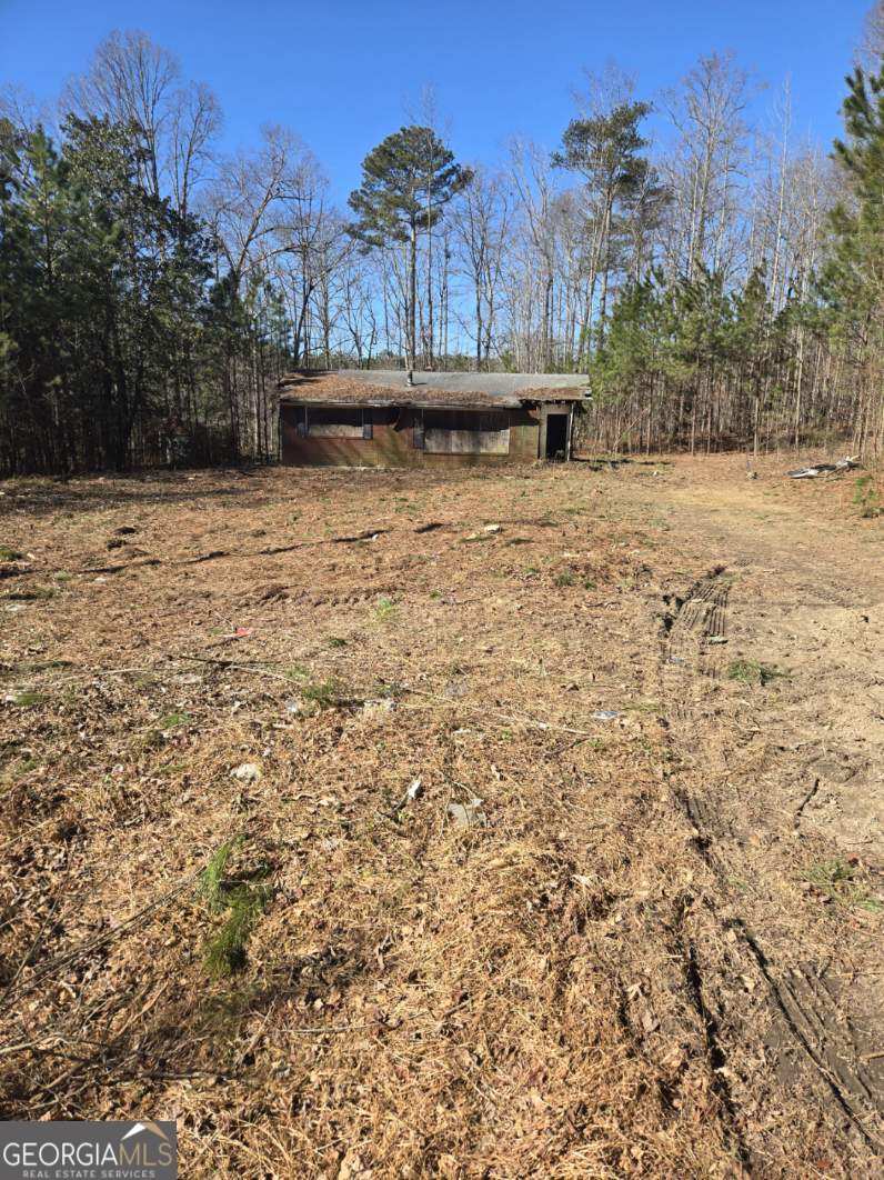 This property is a total rehab. It needs a complete renovation. Property had a fire several years back and in not inhabitable. Great potential for industrial or commercial use.