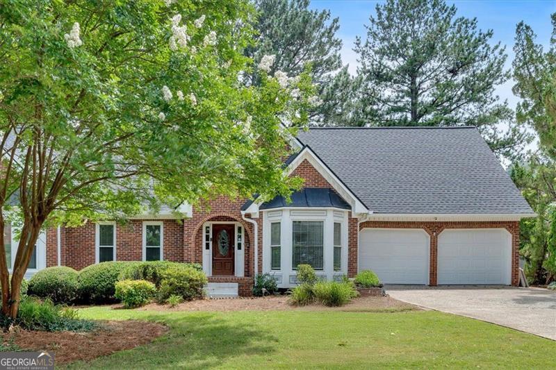 Discover serene lakefront living at 4508 Club House Drive. This stunning 5-bedroom, 4-bathroom residence, nestled in the sought-after Highland Pointe and within the top-rated Lassiter High School district, offers 4,227 sq ft of meticulously crafted space. Imagine waking to breathtaking lake views; every room captures the tranquil water's beauty, creating a peaceful retreat. The main level boasts a spacious family room, dining room, and living room, perfect for gatherings. The kitchen has a huge granite island, granite counters, stainless steel appliances and a breakfast bar. The expansive primary suite, also on the main floor, features a luxurious bathroom with granite double vanities, a huge tile shower, a soaking tub, and walk-in closets. Upstairs, find three additional bedrooms and two full bathrooms, all with granite counters. The finished basement offers a bedroom and flexible space, providing endless possibilities. Step outside onto the deck, overlooking the tranquil lake, and enjoy the community's exceptional amenities: a clubhouse, pool, tennis courts, and an 8-mile jogging trail. A 2-car garage and a security system provide convenience and peace of mind.