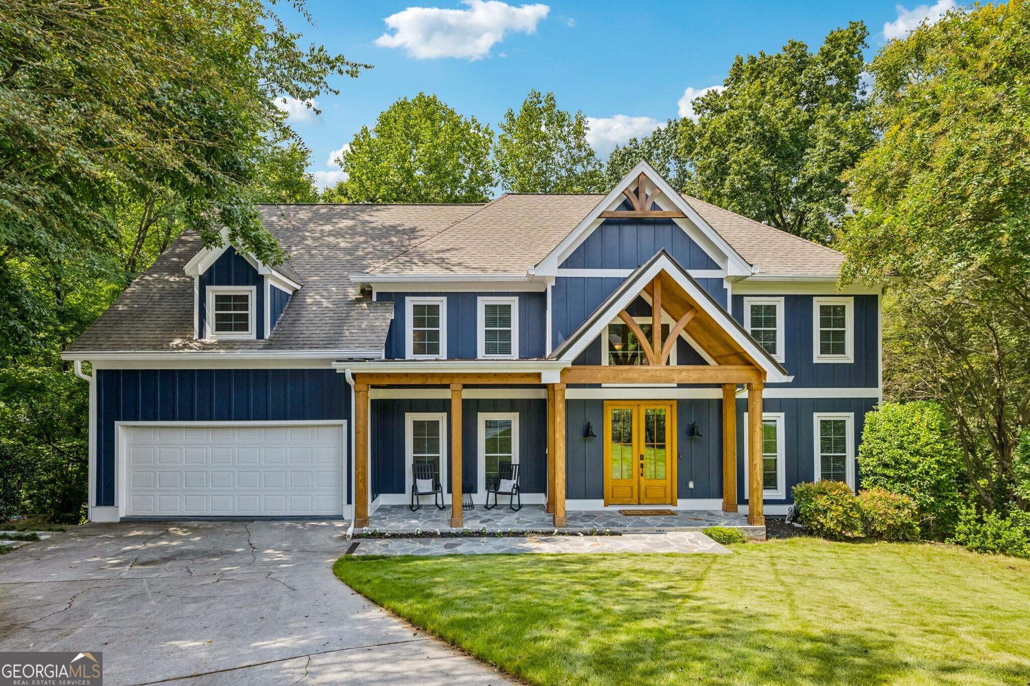 Welcome to your Dream Home in the heart of Brookhaven's most coveted Swim & Tennis Community - Byrnwyck! Perfectly situated on a quiet Cul-de-Sac Lot, this home combines timeless charm with modern updates. The Curb Appeal will stop you in your tracks with a full exterior renovation boasting a Modern Farmhouse feel Dark Blue Hardie Plank Siding, Crisp White Trim, a Covered Front Porch, and striking Natural Wood Double Doors with Glass Panels. A Classic Gable-Style Roof adds charm and dimension, while the Attached Two-Car Garage provides convenience. Step inside to a Light-Filled Grand Two-Story Foyer with Gorgeous Hardwood Floors, Crown Molding, and Wainscoting Wall Details. The Formal Dining Room sets the stage for entertaining, while the Main Level Study offers the perfect Home Office or Flex Space. The Family Room features a Fireplace framed by Custom Built-Ins and a Wet Bar with Sink and Cabinets. A standout highlight is the Huge Sunroom, encased in windows, perfect as a Reading Nook, Quiet Retreat, or Additional Living Space. The Chef's Kitchen impresses with a Large Granite Island, White Cabinets, Stainless Steel Appliances, a Walk-In Pantry, and a cozy Breakfast Nook wrapped in windows with direct access to the Private Back Deck ideal for Al Fresco Dining. A convenient Powder Room completes the Main Level. Upstairs, the Spacious Primary Retreat features a Tray Ceiling, Sitting Area, and a Spa-Like Bathroom with a Double Stone Vanity, Soaking Tub, Glass Shower, Tile Flooring, and Two Closets. Three Additional Large Bedrooms and a Full Bathroom complete the Upper Level. The Daylight Terrace Level is an Entertainer's Dream featuring a Bar with Kitchen, Movie Theater Space, Room for a Pool Table and Games, plus a Bedroom, Flex Space, and Full Bathroom. With Walk-Out Access to a Covered Deck and a Grassy Backyard surrounded by Shaded Trees, the outdoor living continues. Enjoy all that Byrnwyck Swim & Tennis has to offer, with Swim, Tennis, Playground, and Year-Round Social Events exclusive to residents. This prime Brookhaven location provides unbeatable access to Brookhaven, Buckhead, and Midtown, as well as I-285, GA-400, Top-Rated Public & Private Schools, Parks, Trails, Premier Shopping, and Dining. This is more than a home it's a lifestyle. Don't miss your chance to make this Exceptional Brookhaven property yours!