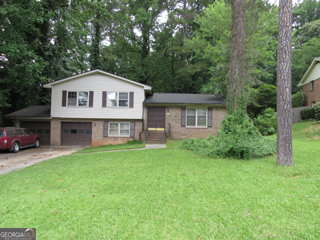 Amazing Opportunity tucked away in small quiet subdivision. Investor special!! 3BR/2.5BA brick and frame split level home. Location is great for access to the Silver Comet Trail, parks, recreation, The Battery, shopping, dining, medical facilities, E/W connector, expressway and more. Home needs total renovation. Main level offers, foyer, formal living room with fireplace, kitchen and formal dining room. Downstairs you will find a nice size den (could be possible 4th bedroom), laundry room and 1/2 bath. All 3 bedrooms and 2 baths are located on upper level. Nice level yard ready for new landscaping and add your fire pit for a nice outdoor retreat. Home sold As Is.