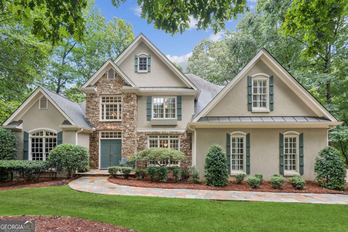 This beautiful custom home is located in the gated golf course community of Chateau Elan Manor Homes! It offers the bright and open floor plan you have been looking for! Great curb appeal situated on a 2 acre lot, double driveway, front stone accent. The two-story foyer opens up to the dining room, office, a warm and inviting great room with a stacked stone fireplace. The updated kitchen featuring high end appliances opens to a light and airy keeping room, breakfast area, and picture-perfect windows that brings so much character to the space. The oversized primary bedroom is also on the main level. The main level has gorgeous hardwood floors and natural travertine tile. Upstairs consists of 3 spacious secondary bedrooms. The finished basement features a 5th bedroom suite with a full bathroom, stacked stone fire place, kitchen, entertainment / family room, large storage room, and a beautiful game room. Heading outside to enjoy the stunning pool with a waterfall, stone patio area leading to the meticulously landscaped backyard. This home is absolutely perfect for entertaining friends and family. Inside the gates of Chateau Elan features several restaurants, 3 golf courses, and The Sports Club facility that includes a Junior Olympic Size outdoor pool, kiddie pool, tennis courts, indoor fitness facilities, fitness classes, indoor gymnasium, access to the Braselton Lifepath and more. Easy access to I-85. Welcome Home to a resort style living in Chateau Elan!
