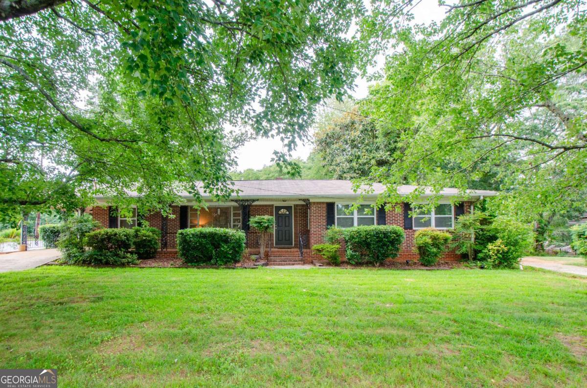 Welcome to 5122 Lavista Road, a spacious and inviting 3-bedroom, 2-bath single-family home nestled in the heart of Tucker! This beautifully maintained home features hardwood floors throughout, an updated kitchen with stainless steel appliances, granite countertops, and a breakfast nook that overlooks the large, backyard-perfect play or outdoor entertaining. The home offers a comfortable layout with generously sized bedrooms and plenty of natural light throughout. The home is being rented fully furnished. Location, Location, Location! This property is ideally located just minutes from downtown Tucker, where you'll find a mix of local dining, boutique shopping, and family-friendly events throughout the year. Enjoy easy access to I-285 and US-78 for a quick commute to Atlanta or Decatur. Nature lovers will appreciate being close to Henderson Park, with walking trails, tennis courts, and a lake, as well as the popular Tucker Nature Preserve. Northlake Mall, schools, and grocery stores are all nearby, making everyday living easy and convenient.