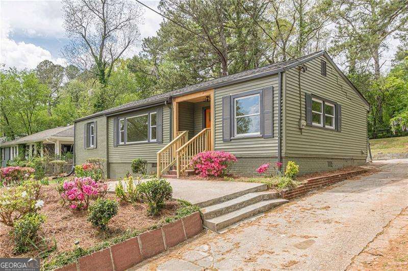 Just steps from the iconic East Lake Golf Course, this fully renovated bungalow blends timeless charm with modern upgrades in one of Atlanta's most sought-after neighborhoods! With over 1,700 square feet of beautifully finished space, this 3-bedroom, 3-bath stunner features luxury vinyl plank floors throughout, a bright open kitchen with white shaker cabinets, quartz countertops, and stainless steel appliances. The spacious owner's suite offers a true retreat with a double vanity, walk-in closet, and private access to the backyard. One of the additional bedrooms includes its own en-suite bath - ideal for guests or roommates - while the third full bath serves the rest of the home. All three bathrooms are brand new and fully tiled with stylish, high-end finishes. Enjoy peace of mind with a brand-new HVAC system, water heater, and everything updated from top to bottom. Outside, the mature garden and generous backyard create the perfect space for entertaining, relaxing, and even extra parking. This is the East Lake lifestyle - upgraded. Welcome Home!