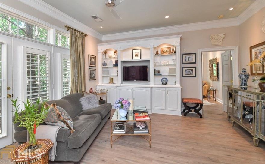 Beautiful Sandy Springs midrise with 10' ceilings. Tastefully updated new kitchen with quartz counters, white cabinets, new appliances, grey glass subway tile backsplash. Open to family room with built-ins. New floors, new HVAC, new water heater. Beautiful master suite with updated bath featuring jetted tub and frameless shower, new Restoration Hardware fixtures, awesome closet. Secondary bedroom with built-in's ideal for home office. Shutters. 2 Deeded Parking Spaces. Storage room. Building has a club room with catering kitchen, workout room and concierge. Conveniently located near Northside, St Joseph's and Scottish Rite Hospitals, GA400, I-285, shopping, dining and more!