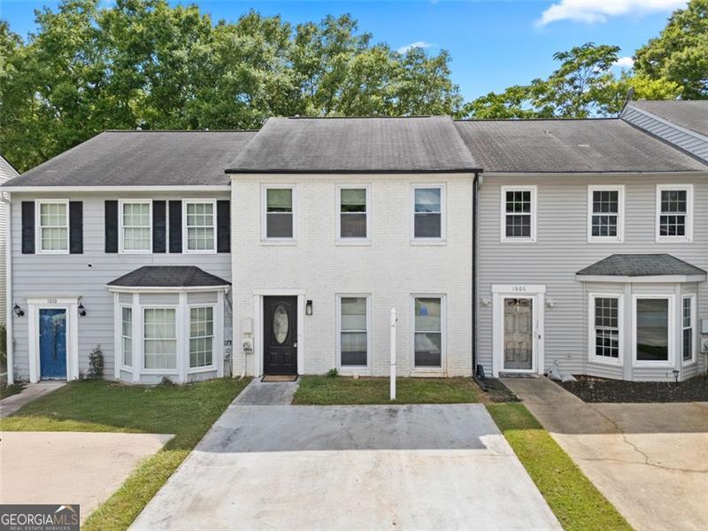 Welcome to this thoughtfully designed and move-in ready townhome in the heart of Smyrna- featuring updated bathrooms, a private fenced yard, and no HOA! This home offers the perfect combination of privacy, functionality, and location for homeowners or investors. The main floor offers a traditional layout with a separate dining room, kitchen, and living room. A pass-through opening between the kitchen and living room enhances light and flow, and a convenient half bath is included for guests. Upstairs is where this home truly shines. You'll find two large bedrooms, each with its own updated en-suite bathroom, offering excellent privacy and comfort - perfect for roommates, guests, or families. A laundry unit is located between the two bedrooms, providing a practical and efficient layout for daily living. The upper floor is ideal for shared living or rental use, with clearly separated private spaces and modern finishes throughout. Step outside to enjoy the fully fenced backyard, a truly private outdoor space ideal for relaxing, gardening, or letting pets roam freely. Situated in a quiet residential neighborhood with no HOA fees or restrictions, and just minutes from I-285, I-75, Cumberland Mall, The Battery Atlanta, and a variety of shops and restaurants - this property is a rare opportunity in a prime Smyrna location.