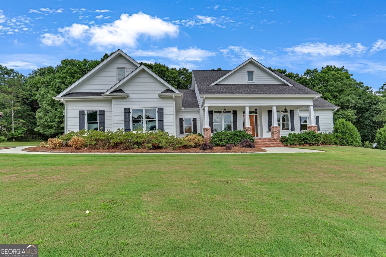 THIS ONE IS NOW ON THE MARKET! ENJOY A BEAUTIFUL CUSTOM RANCH WITH 10.0 AC LOT -A BIG RED BARN, AND A FENCED FRONT PASTURE ! A WELL WATER IRRIGATION FOR THE PASTURE , YARD & BARN IS A BLESSING! THIS MINI FARM IS READY FOR YOUR HORSES, GOATS AND CHICKENS AND WILL NOT DISAPPOINT! ! THE INTERIOR OF THE HOME WILL NOT DISAPPOINT EITHER BECAUSE IT HAS BEEN WELL TAKEN CARE OF AND SHOWS LIKE BRAND NEW ! A GRAND ENTRANCE INTO THE FOYER FROM THE COVERED FRONT PORCH SHOWCASES THE DINING ROOM AND LIVING/FLEX ROOM TO THE VAULTED FAMILY ROOM W/A RED BRICK FIREPLACE AND HIDDEN TV CABINET. THE CUSTOM PINE CABINETS, OVER-SIZED SOLID PINE DOORS AND PINE FLOORS SHOW BEAUTIFULLY THROUGH OUT THE HOME. THE ACCENT OF BRICK IN THE VLTD FAMILY ROOM, KITCHEN & BATHROOMS ARE STUNNING. THE OPEN KITCHEN HAS BLACK HONE GRANITE COUNTERTOPS, WALKIN PANTRY, DESK AREA, LOTS OF CABINETS, A FARM HOUSE SINK AND EAT IN BREAKFAST AREA PLUS ALL THE APPLIANCES ARE INCLUDED- EVEN THE SPEED QUEEN WASHER AND DRYER IN THE LAUNDRY ROOM. A WALKUP UNFINISHED ATTIC IS AVAILABLE ON THE MAIN LEVEL-NO PULL DOWNSTAIRS!! THE PRIMARY SUITE OFFERS DBL TREY CEILING, SITTING AREA, WALKIN CLOSET & CUSTOM ENSUITE HAS DOUBLE VANITY , LOTS OF CABINETS FOR STORAGE AND A SEPARATE WALKIN SHOWER & CLAW FOOT TUB. THE SPLIT BEDROOM PLAN HAS A BEDROOM WITH WALKIN CLOSET, AND ATTACHED BATHROOM WITH A LARGE SHOWER AND 3RD BEDROOM ON THE MAIN HAS AN ATTACHED HALL BATH WITH A SHOWER. THE NEWLY PAINTED DECK AND SCREEN PORCH IS LOCATED ON THE MAIN AS WELL. THE FINISHED BASEMENT OFFERS A HALF BATH, LARGE 4TH BEDROOM W/ATTACHED BATHROOM PLUS A LARGE RECREATION SPACE WITH POOL TABLE, THEATER ROOM, SEVERAL CLOSETS AND A SAFE/ STORAGE ROOM! THE SEPARATE WORKSHOP IS LOCATED IN THE BASEMENT TOO! A WALKOUT UNTO THE REAR PATIO AND BACK YARD IS A PLUS! JACUZZI HOT TUB WILL STAY! MORE UPGRADES AND FEATURES -TOO MANY TO LIST HERE BUT A LIST WILL BE PROVIDED. SO TRUE ABOUT LOCATION, LOCATION!! THIS HOME IS LOCATED OUTSIDE THE CITY LIMITS BUT CLOSE ENOUGH TO ENJOY THE DOWNTOWN RESTAURANTS, SHOPPING AND GREAT COMMUNITY EVENTS SUCH AS FESTIVAL, PARADES & CONCERTS ON THE TOWNE GREENE! THIS ONE WILL GO FAST! CALL TO SEE TODAY!