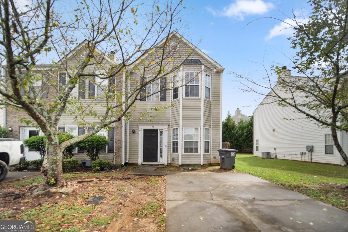 Welcome to this beautifully maintained end-unit townhome in The Village on Grassdale! This move-in ready 2-bedroom, 2.5-bathroom home offers 1,498 sq. ft. of comfortable living space with an open-concept design and abundant natural light. Step inside to find easy-care laminate wood flooring throughout-no carpet! The spacious living room features a charming bay window and a cozy wood-burning fireplace, while the dining area flows seamlessly into the bright kitchen with white cabinets, a breakfast bar, pantry, and built-in microwave. Upstairs, both bedrooms boast their own bay windows and private en-suite bathrooms with tub/shower combo. The primary suite includes a walk-in closet. A convenient half bath is located on the main level. Enjoy outdoor living with a private fenced backyard, patio space, and a storage shed, perfect for entertaining or relaxing in peace. Located near shopping, dining, and schools, this home also offers quick access to Highway 41 for easy commuting. Low HOA fees cover common area maintenance, making this a wonderful choice for homeowners.