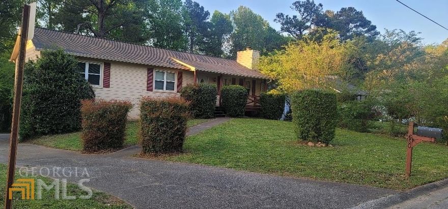 Enjoy this beautiful and updated home on a gorgeous almost half acre level lot. This home has a partially finished basement and even more room to expand and grow.  There is a spacious family room with a wood burning fireplace and it connects to the kitchen with a window view.  There kitchen has a nice eat-in area with beautiful updated expresso cabinets with new hardware, and updated floors. A rear entry garage and extra parking is perfect for privacy and additional space.  There is a large rear concrete pad that is currently used for a basketball play area.  This conveniently located Marietta home has so much to offer.  It won't last long, so schedule a showing soon!!