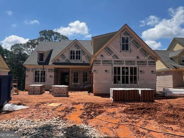 Home is Under Construction. The Charlotte plan by Tipton offers an outstanding living experience in the highly desirable Buford City School District. This 5 Bed/4.5 Bath home boasts quality craftsmanship, stylish finishes, and an open concept layout. Enter to 10' ceilings on main, a chef-inspired kitchen, complete with a large quartz island, walk-in pantry, upgraded stainless steel appliance package-all overlooking the open breakfast area and the expansive family room with built-in shelving and beams. Separate Dining Room/Flex Room. Additionally, complimenting the main level, mudroom & lockers off the garage next to the laundry room equipped with sink. Oversized Owner's suite on main includes relaxing spa-style bath with frameless glass shower, free standing soaking tub, quartz vanity and expansive walk-in closet. Spacious guest bedroom on main w/ attached ensuite and grand walk-in closet. Upper level leads to 3 generously sized bedrooms, 2 bathrooms, a media room, second level laundry room and additional storage space. The unfinished basement provides even more space for your personalized touches with unlimited potential. Large, covered deck with outdoor fireplace overlooks private back yard situated on .45 acre lot. Home is conveniently located near top rated Buford City Schools, easy access to downtown Buford dining, shopping, entertainment, parks, Lake Lanier and more!
