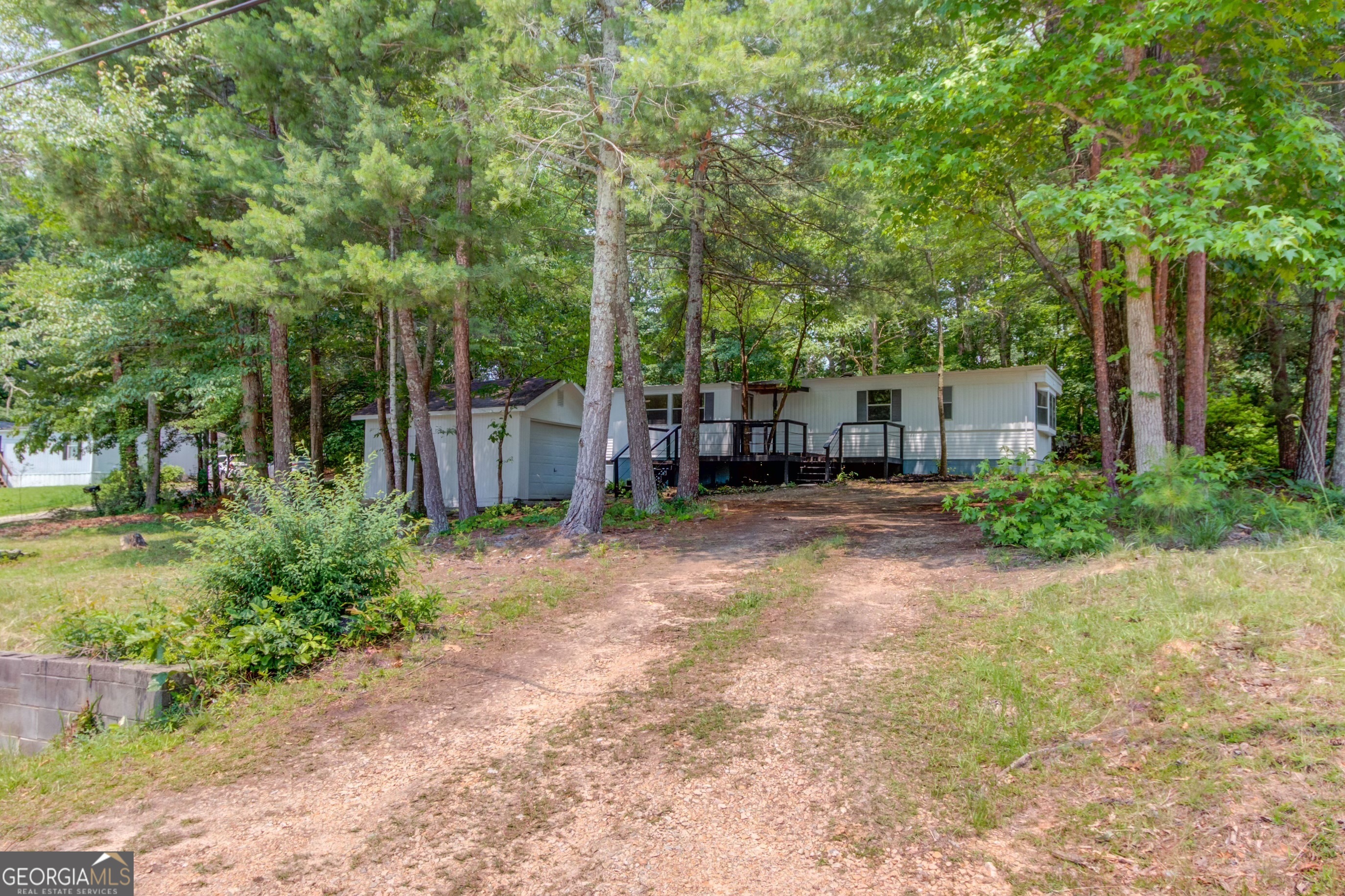 Calling all investors and savvy buyers! CASH ONLY! This is your chance to own one of the most affordable move-in ready homes in Hall County-NO HOA, a private lot, and just minutes to schools, Oakwood, and Lake Lanier public access. Whether you're looking to live in, rent out, or customize further, this 3 bed / 2 bath home has a ton of upgrades already done for you: Fresh interior & exterior paint Brand new kitchen cabinets, flooring, and subfloor Updated plumbing, light fixtures, and electrical (including new meter & box) Two beautifully renovated tile bathrooms with new vanities, toilets, faucets & fixtures New interior wall panels, door handles, and deck railing Detached garage freshly painted-perfect for tools, toys, or your RV/boat Roof and AC unit recently inspected and cleared. Don't miss this rare opportunity to own a solid, upgraded home in a prime location-value like this won't last long!