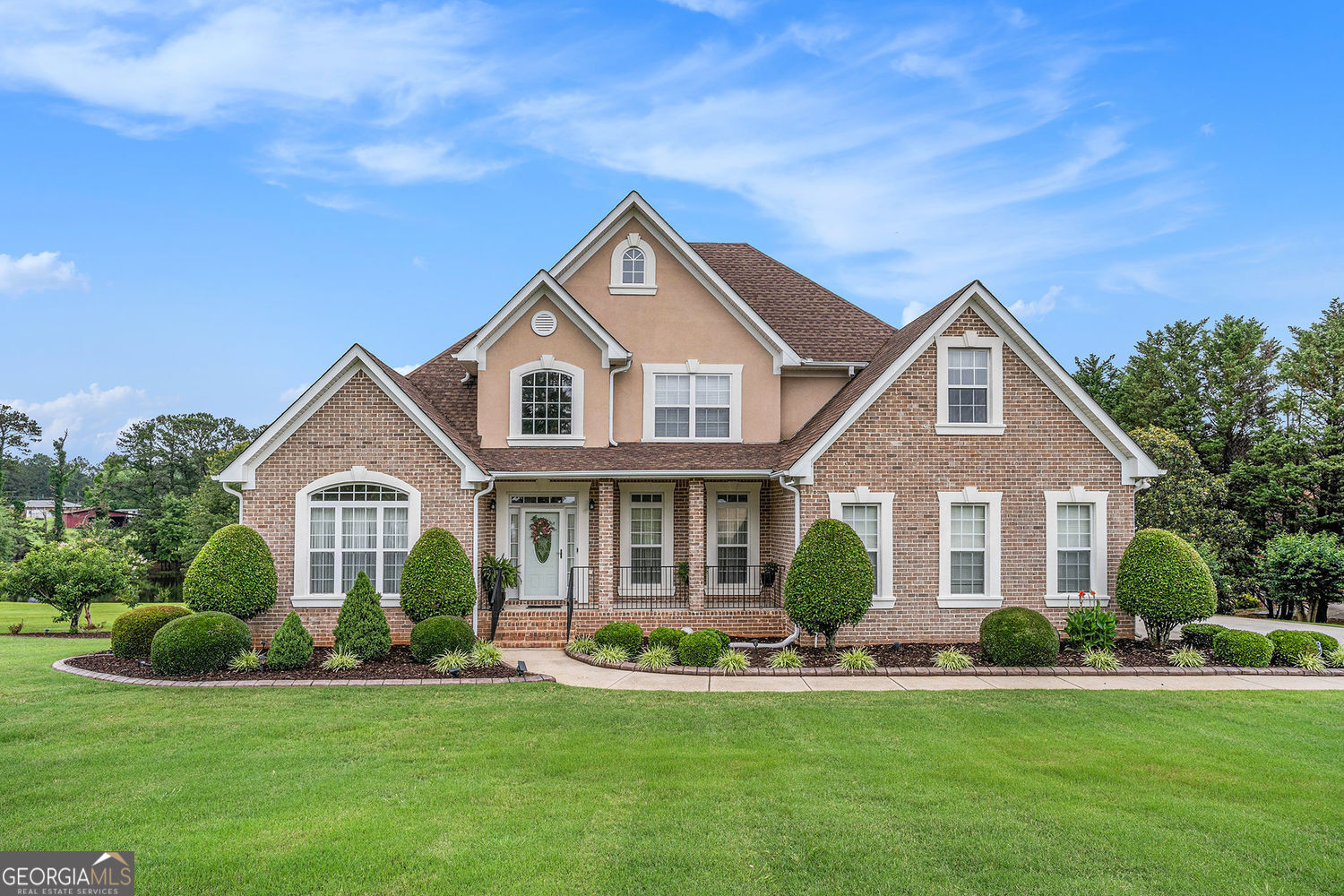 Simply AMAZING: Four side brick, 5 bedrooms, 4.5 bathrooms, full finished basement, separate Living Room, Dining Room, Family Room, Kitchen with granite countertops, Large deck overlooking lake, Boat garage door in basement, Beautiful Landscape, No HOA, and much more. This home is a beautiful 5BR/4.5BA brick 2 story, with a great floor plan. It has upgrades galore, and a wonderful bonus room. Flooring in the home includes tile, woods, and carpet. The huge primary bedroom has a large sitting area and a luxurious bath w/whirlpool tub. The kitchen is fit for a chef w/large walk-in pantry, granite counters, center island, stainless steel appliances, and gas range w/convection oven. Adjacent to the kitchen is a family room w/fireplace, and the entrance door to a large deck overlooking a lovely garden and lake. This house is located on a 1+/- acre lot. NOTE: Property taxes reflect an exemption to the school tax by the current owner. Thank you for your interest in this home and I look forward to working with you.