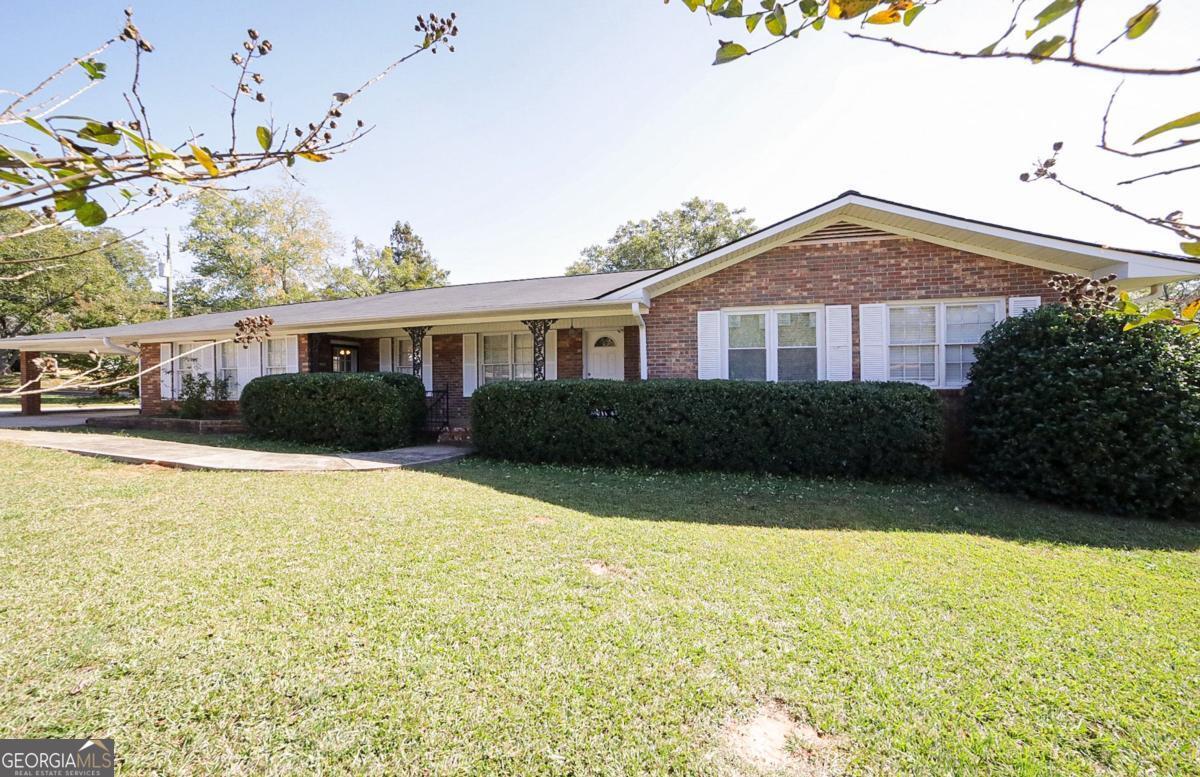 Hosted in the heart of Danielsville boasting direct convenience to Hwy., 29 and schools, is a pristine, move-in ready ranch thats more than meets the eye. Designed in the ever-desirable, single-level ranch style, this bright and airy home boasts notable updates - like the new roof and HVAC in 2022, along with standout appointments sprinkled throughout. Presenting a formal layout with multiple living areas, this easy-living home provides ample space for large gatherings as well as more intimate settings. Welcomed by the gracious living/dining room combination, the exciting details come alive with pristine hardwood floors and fresh designerss-choice paint throughout. Providing an effortless transition, the keeping room with French doors to the exterior is just around the corner, and allows the home chef to interact with guests. Quite spacious, the kitchen features wall-to-wall of counter space and wood cabinets, allowing for ample room for all your culinary needs. A complete appliance package including the refrigerator provides the finishing touch. Need a little flex space, rec. room or the perfect spot to host game-day parties, then look no further than the oversized bonus room. Crafted in the sunroom style with 180 of windows and a tile floor, this expansive addition is the jewel of this home. Tucked away down the right hall you can find 3 cozy bedrooms and 2 full baths. Each sunlit bedroom offers newer plush carpet flooring, updated ceiling fan light fixture and ample closet space. The primary suite standouts with an updated ensuite full bath. Outdoor living is made possible with the rear deck encompassed by new privacy fencing. To provide a little more privacy, the fencing is extended around the parameter of the home to the driveway. The rear yard also boasts a storage shed for lawn equipment and the perfect powered workshop providing a variety of multi-use options. Updates, immense living space, easy-living design, and Danielsville convenience, are the true hallmarks of this move-in ready home!!