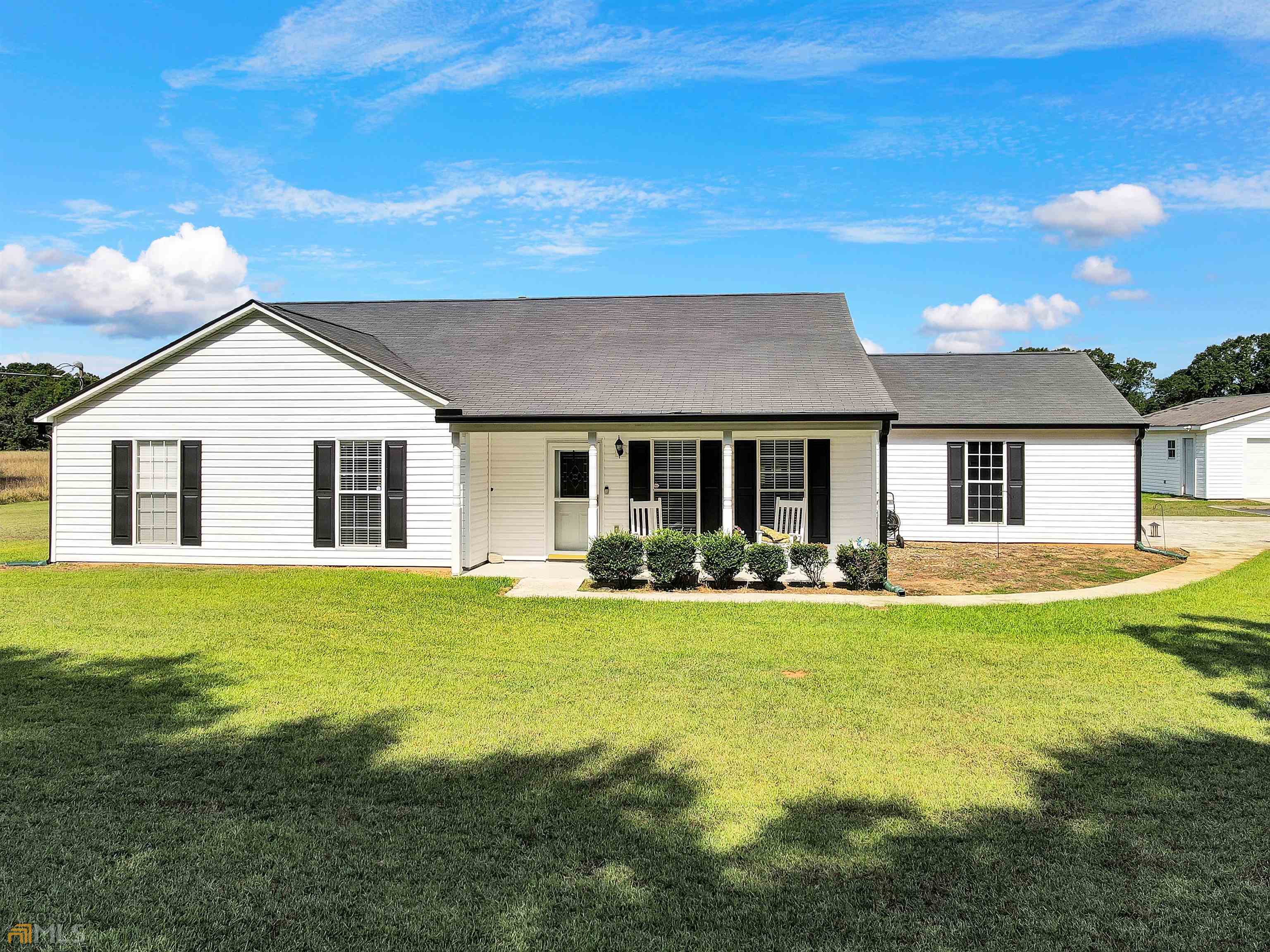 Stunning 3 bedroom/2 bath ranch on 4.3 acres. This amazing home offers in addition to the 2 car attached garage, you have a 2 car detached garage as well. Screened in porch, huge family room and separate dining room. Open concept kitchen w/breakfast bar, and breakfast. The outdoors offers the most amazing view imaginable, with 4 acres of lush, beautiful grass and trees. AND, it's convenient to I-75 and the new upcoming airport.