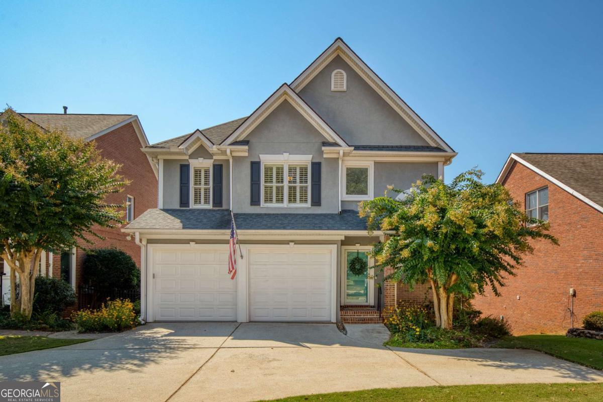 Tucked away on a quiet cul-de-sac just minutes from the vibrant Marietta Square, this picture-perfect home blends timeless charm with modern sophistication. From the moment you arrive, you'll be captivated by the home's curb appeal, complete with a mature landscaping, and a welcoming front porch. Inside, natural light pours through plantation shutters and large windows, highlighting the home's airy, neutral palette and hardwood floors. The open-concept main level offers ideal flow for both everyday living and entertaining. A cozy living room centers around a gas fireplace and opens directly onto a spacious deck-perfect for enjoying morning coffee or evening cocktails with a view of the private, fenced backyard below. The beautifully updated kitchen is a standout feature, designed with clean white cabinetry, granite countertops, a sleek tile backsplash, and stainless-steel appliances. A sunny breakfast nook with wraparound windows provides a cheerful space for casual meals, while the adjacent formal dining room is enhanced by elegant wainscoting and a custom butler's pantry and wine bar, ideal for hosting with style. Upstairs, you'll find a serene and spacious primary suite with tray ceilings, plenty of natural light, and room to unwind. The en-suite bathroom features a soaking tub, dual vanities, and a walk-in shower. Two additional bedrooms are well-sized and share a convenient Jack and Jill bath. The bright, daylight basement is a rare bonus, complete with stylish tile floors, gorgeous, coffered ceilings, a half bath, and flexible living space perfect for a media room, game room, or home office. There's also an unfinished storage area with endless possibilities. Step out from the basement to a lush backyard retreat-fully fenced, landscaped with care, and featuring a charming brick walkway that loops around to the front of the home. Located just moments from Wellstar Kennestone Hospital, charming local shops, award-winning restaurants, and weekend farmers markets at Marietta Square, this home offers both convenience and community. This location truly has it all, with convenient access to the M2R Trail and Lewis Dog Park, perfect for your furry friends, easy highway access, and the benefit of top-tier amenities right at your fingertips.