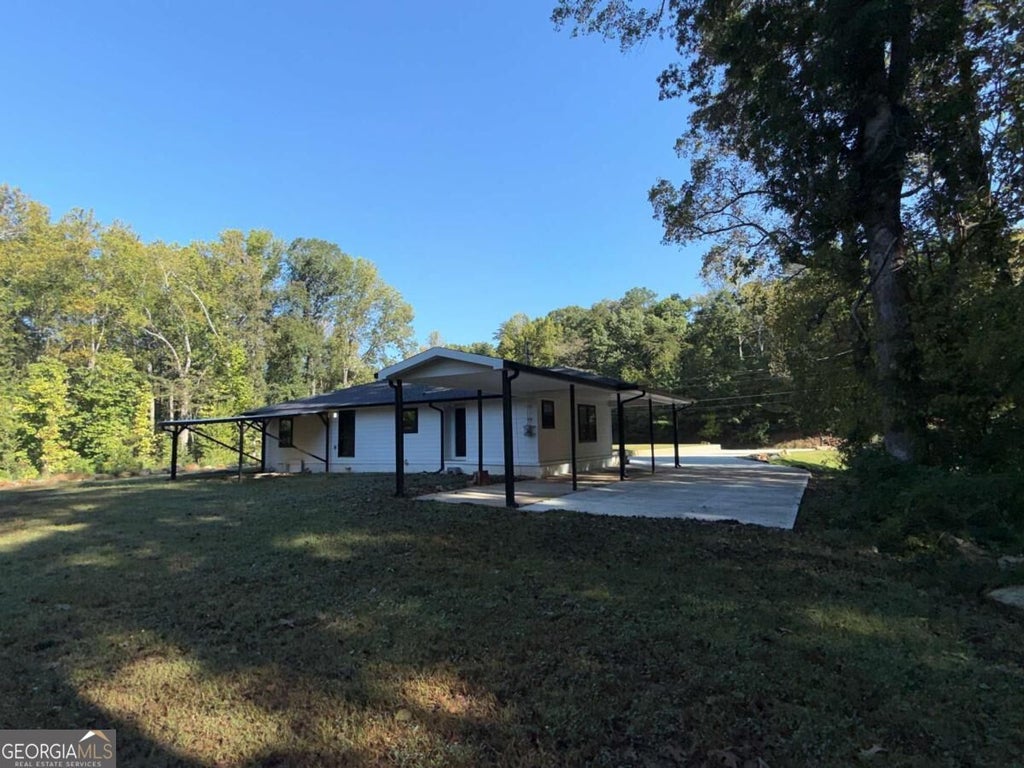 Photo of 2521 Reinhardt College Parkway, Canton, GA 30114 (MLS # 10874897)
