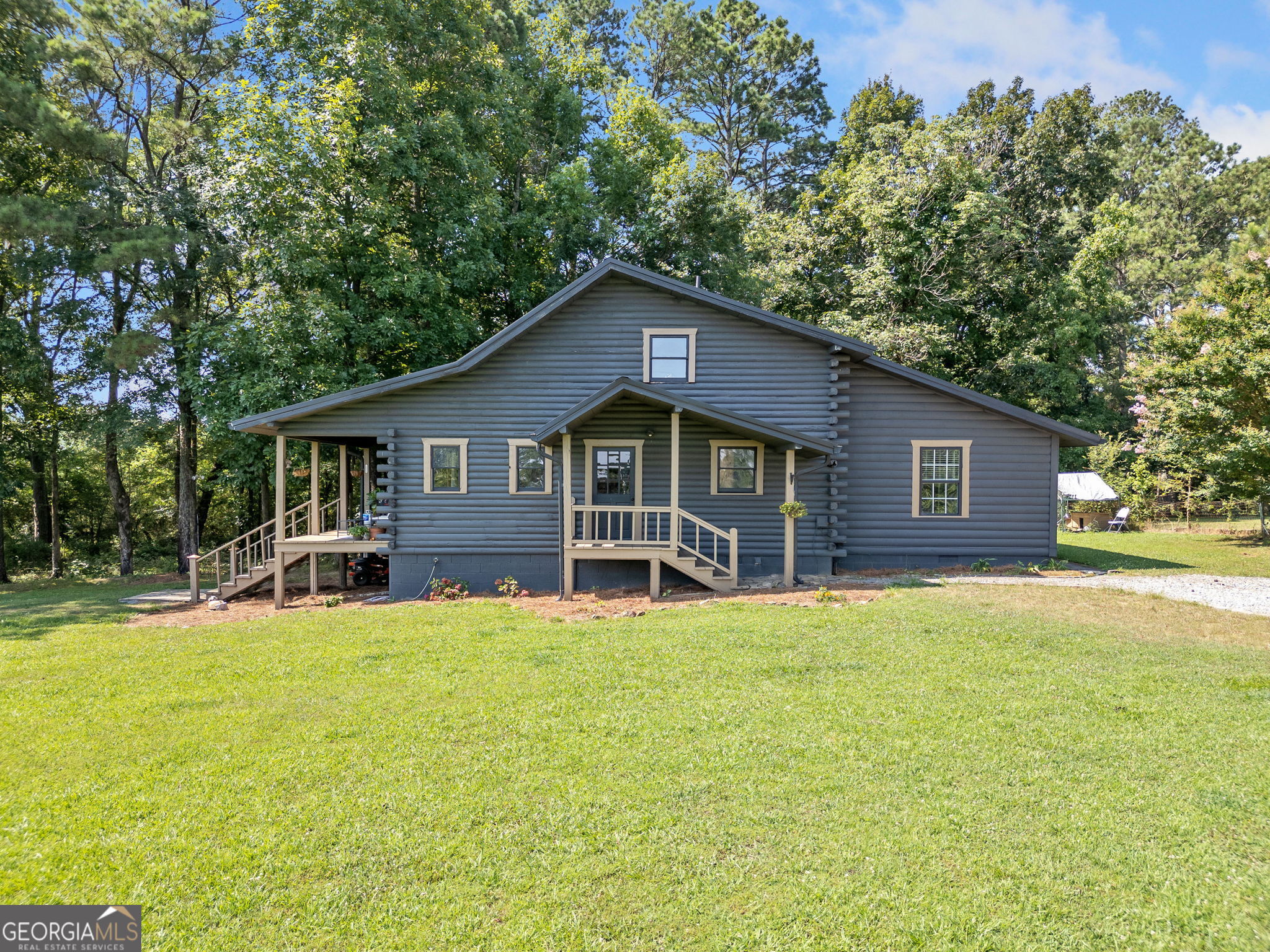 Come home to this Mountain-getaway Cabin or Full-time living in the North Georgia Mountains. No HOA so make it your own Retreat. All roads leading to this property is paved except the 100' driveway. This gem offers a Rocking Chair Porch, Rustic kitchen, High beam wood ceilings, Hardwood floors, Wood walls and doors. Lots of natural light. The two separate flexible loft areas are being used for a bedroom and storage that could easily be transformed to another bedroom and/or office. Other Features: Laundry room and Master on Main. NEW: Carpet, HVAC system, Kitchen flooring, Interior and Exterior paint. 1.67 Acres of ample space of Nature, Outdoor entertainment and Parking: Bring your Farm Animals, Pets, Chickens, RV, Work Truck, ATV, and other toys. If you're ready for your next chapter as Nature lovers and Comfort seekers, then don't hesitate to purchase and hold the keys to this one!
