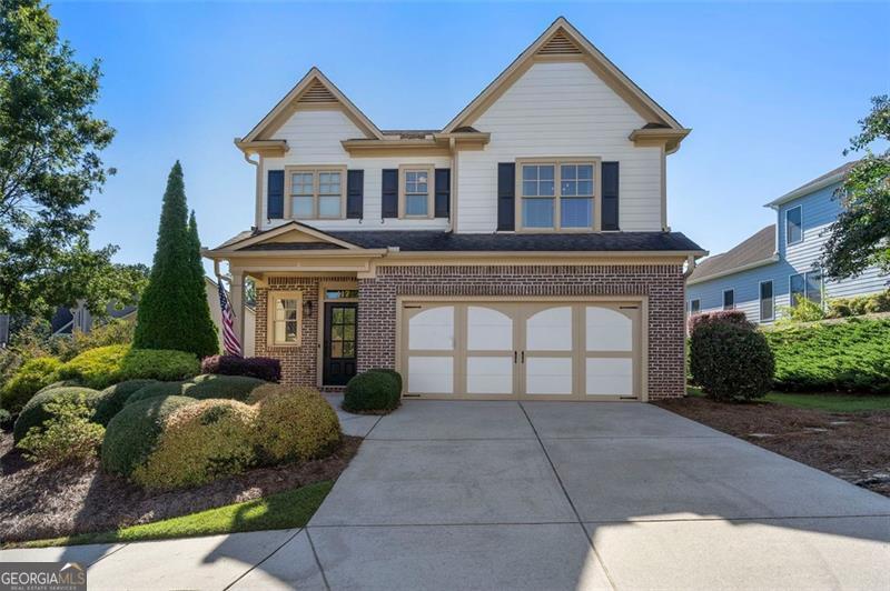 Welcome home to a fabulous updated home in popular Cornerstone Park in Woodstock! Step inside to an inviting foyer with hardwood floors that guide you into the heart of the home: a completely renovated kitchen. It boasts a huge granite island with a breakfast bar, pristine designer white cabinetry with abundant storage, a large pantry, like-new stainless steel appliances including a gas range, and a custom tile backsplash all overlooking the cozy, fireside family room. For more formal occasions, the separate dining room boasts crown molding and sophisticated wainscoting and custom lighting. As you head upstairs , note the under the staircase shelves and wrought iron balusters. The upper level lands in a versatile open loft, perfect as a bright daytime office, an evening gaming hub, or a serene yoga space. The oversized primary suite features a generous walk-in closet and a spa-like bathroom with a double vanity, soaking tub, and separate shower. Two spacious secondary bedrooms share a second full bathroom with dual sinks. Check out the super clean impressive two-car garage, featuring a polished epoxy-coated floor, built-in cabinets, a workbench, and ample shelving. A 40-square-foot outdoor storage closet with power, lighting, and double doors is the perfect place for holiday storage at your fingertips. Your private, covered patio overlooks a lovely, huge side yard with irrigation, offering a perfect spot for relaxation or entertaining without the upkeep. Experience the coveted "lock and go" lifestyle, with the HOA meticulously maintaining all yards, bushes, and trees for a consistently fresh look. Situated in the desirable Cornerstone Park community, this home is just minutes from the vibrant downtown areas of both Woodstock and Roswell. Just half a mile from two fitness centers, several restaurants, an Aldi, and Dunkin' Donuts. Enjoy the perfect blend of tranquility at home and convenience at your doorstep.
