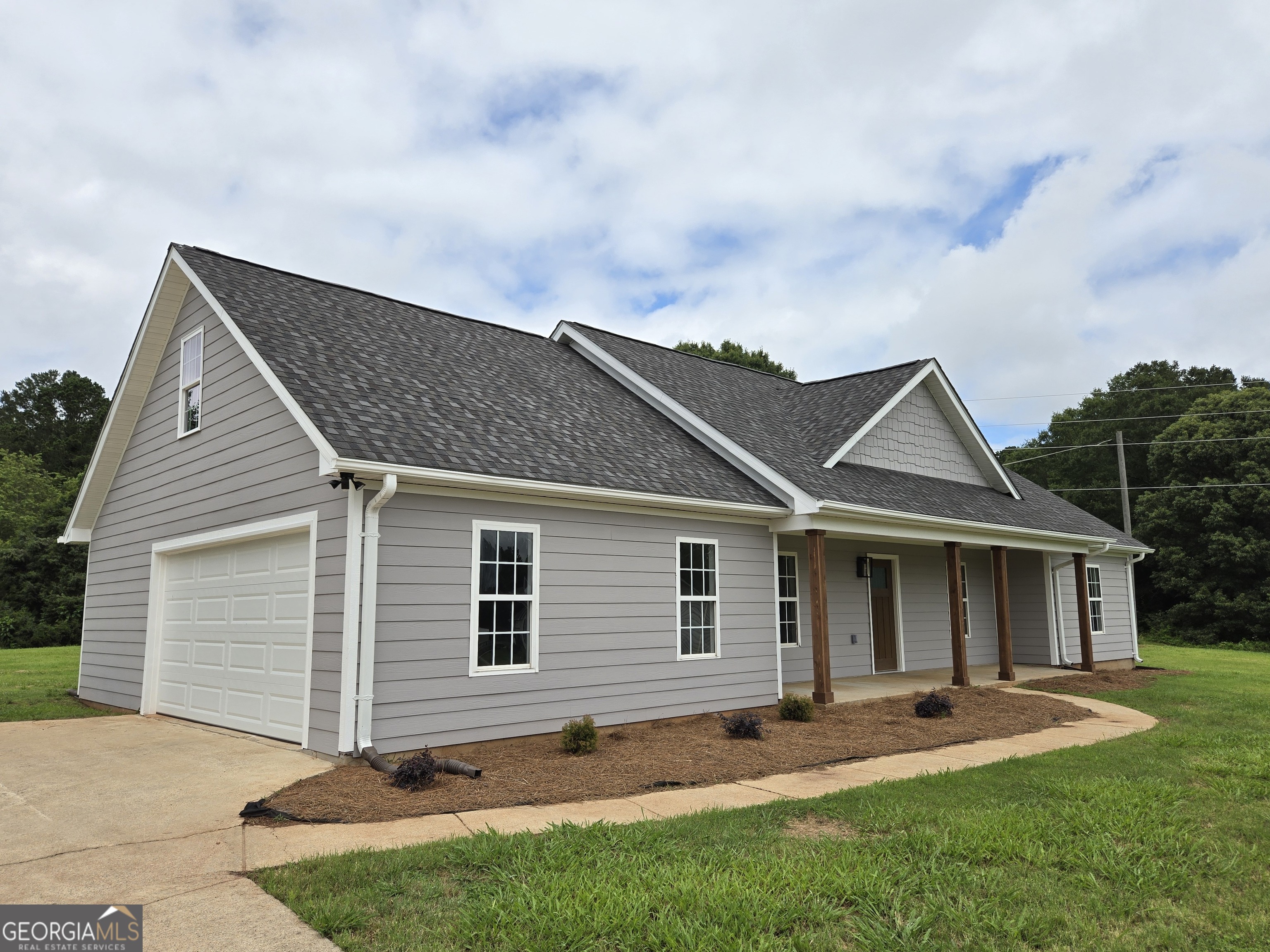 Welcome home to 388 Kay Drive! This beautiful, totally renovated home is situated on a large cul-de-sac lot the size of which is rare to find in a new construction. New exterior items include roof (30-year GAF architectural shingles), Hardie board cement siding, front porch, all entry doors and garage door w/opener. Exterior smart security cameras already installed. Lifetime windows are on order for the sliders in the kitchen, living room and the first bedroom and will be installed by 6/20. Inside, all new plank flooring (no carpet in house), LED light fixtures, and a cozy electric fireplace. The heart of the home boasts a gourmet kitchen featuring all new cabinets, quartz countertops, stainless steel appliances and farmhouse sink. The master bath features a double vanity, luxurious Roman bathtub, and a separate shower. Upstairs you will find a spacious flex space with closet that can be used as a fourth bedroom. Double Garage with Storage closet. No HOA and located just 10 minutes from 316, 20 minutes from I-85.