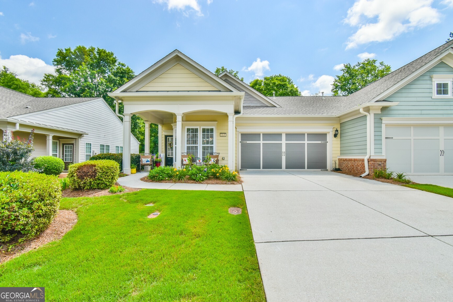 Welcome to your dream retreat in the highly sought-after 55+ Village at Deaton Creek where you will enjoy security, carefree living, resort-style amentities and a vibrant social calendar! This beautifully-maintained sunlit villa with its open-concept layout is designed for comfort and easy living. This beauty offers a large primary suite with customized walk-in closet and one guest bedroom. A warm and elegant ambiance is created throughout the main living area with gleaming hardwoods that flow throughout, and the abundance of windows that bring the ouside in. The well-designed kitchen offers great counter space, abundant cabinets, a spacious pantry and a sunlit bayed breakfast area. Step outside to your private backyard oasis - this serene space backs up to a peaceful wooded area, offering both privacy and natural beauty. A charming wrought iron fence frames the yard, while a large patio provides the perfect setting for morning coffee, evening relaxation, or entertaining guests under the open sky. Conveniently located just a short distance from shopping, dining, and the top-ranked Northeast Georgia Medical Center. Hurry and don't miss the opportunity to call this villa, which is the perfect blend of lifestyle, location and low-maintenance living, your new home.