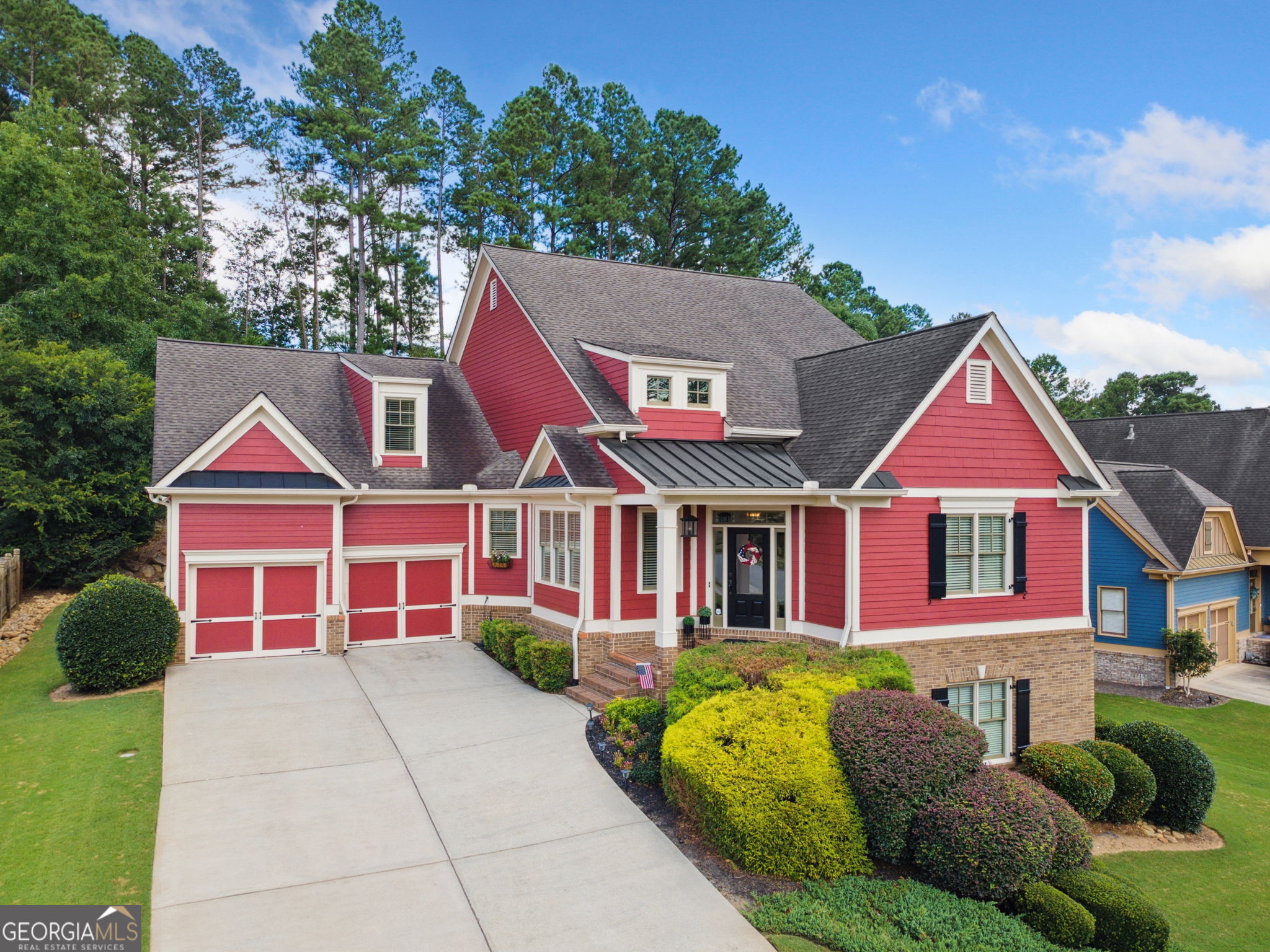 This is one of those homes you have to see to truly appreciate. Three levels of beautiful craftsman style designed by renowned architect Jeremy Rutenberg. It is the perfect balance of exquisite design highlighting thoughtful function and beauty. It has a unique floorplan filled with character. From the minute you walk in, you'll know this is not a cookie cutter home. With a total of 5 bedrooms and 4.5 bathrooms this home welcomes you through the door with gorgeous site-finished hardwood floors. The main level boasts three bedrooms, two spacious rooms in the front of the home as well as the primary suite on the back of the main level. The primary bedroom is a restful, private retreat with pretty transom windows and a fully renovated spa-like bathroom and dual his & her closets. It is a must-see. The chef's kitchen has all new stainless-steel appliances, including double ovens and a gas range, as well as an oversized island with new quartz countertops. They say the kitchen is the heart of the home, and this one is centered in this open floor plan with views into the large, oversized dining room and the cozy living room with fireplace. Off the living room is the covered back porch, perfect for taking in the outdoors during any season. Enjoy gorgeous sunrises through the trees out back with your morning coffee. The yard has been carefully landscaped in both front and back with flowers and shrubs to complement the home's elevation and topography of the yard. Deer frequent the yard most nights and you'll fall in love with the "sunset porch" out back with chairs and a firepit to take in the purple-pink sunsets over the top of the house. The expansive basement has been finished to the same level of quality craftsmanship as the main level. It's expansive, with enough finished space for a second living room, an office or game room, another bedroom and bathroom. The unfinished area is roomy enough for a second kitchen, an additional bedroom, a home theater, and plenty of storage. With plenty of room for growth and additional entertainment space, the potential is limitless. But this house isn't done yet. The top level has an oversized bonus room and full bathroom. It's perfect as an office, a game room or a teen-suite. The owners have meticulously maintained the home. It has new interior and exterior paint, completely renovated primary bathroom with marble vanities, two new HVAC units, all new(er) upgraded fixtures throughout the home, new board & batten in the dining room and an added shiplap accent wall in the bonus room and the basement living room. This home is full of thoughtful surprises all the way down to the three-car garage with tandem spaces, perfect for a boat, jet skis or golf cart. Any of which are ideal for a home only 5 minutes from Lake Allatoona and surrounded by several top golf-courses. Close to restaurants, great shopping and top schools this home is a rare find. Schedule your showing today!