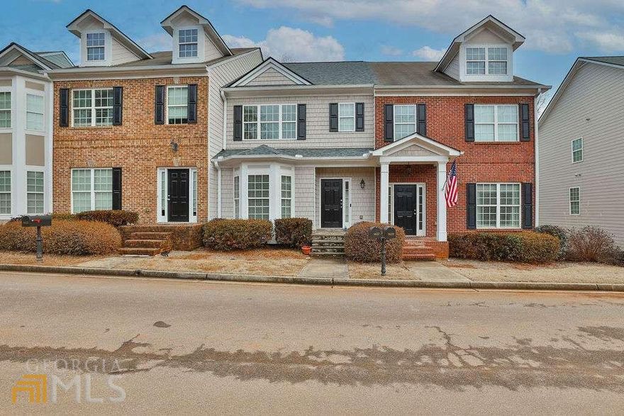 Rare 4 bedroom unit in The Bluffs at Lanier! Tucked away off Dawsonville Hwy, this gated community is close to shops and walking distance to Lanier Point Park on Lake Lanier. This 4 bed, 3.5 bath unit was the model home and has primary on main with en-suite bath, double vanity, and garden tub. On the second story you will find another large bedroom with en-suite, plus 2 addition bedrooms with a shared full bath. This home has many upgraded features including hardwood floors on main, cherry kitchen cabinets, granite counters, stainless steel appliances, custom blinds, stereo sound system, and 9 foot ceilings with custom crown molding. Newer HVAC system, oversized 2 car garage, and plenty of storage. Don't miss out on this opportunity!