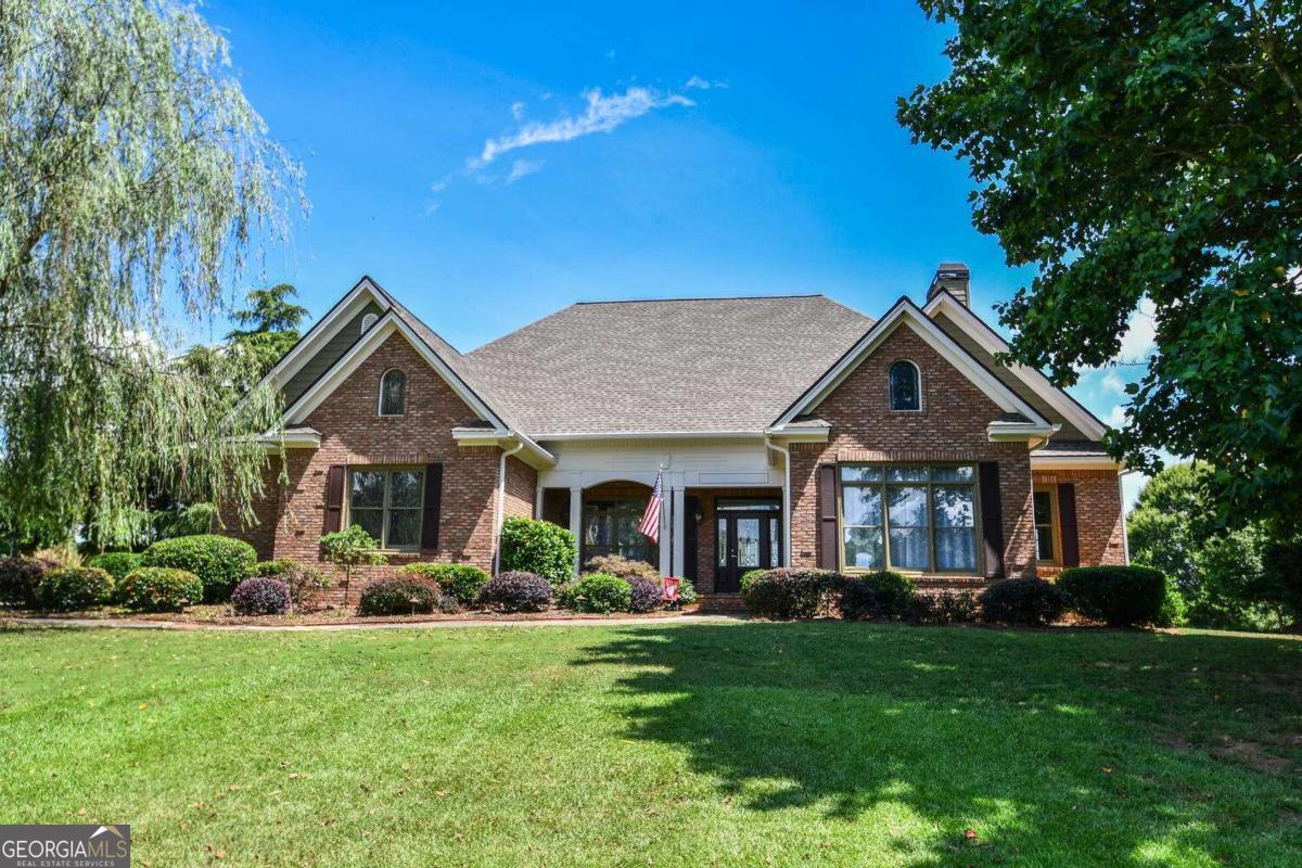 Bask in mountain views and backyard bliss from this timeless all-brick Craftsman, perfectly perched in one of the area's most coveted communities. From the sparkling pool to the stylishly updated interiors, every detail is designed for effortless living and everyday luxury. The freshly renovated kitchen shines with quartz countertops, stainless appliances, and finishes that strike the perfect balance between beauty and function. The floor plan? Incredibly versatile-two bedrooms on the main (including a serene primary suite), two more upstairs, plus a spacious bonus room for play, work, or winding down. Thoughtfully connected living and dining spaces flow outdoors to a covered porch and fenced yard made for memory-making. With top-rated schools, modern updates, and undeniable curb appeal, this move-in-ready retreat is the total package.