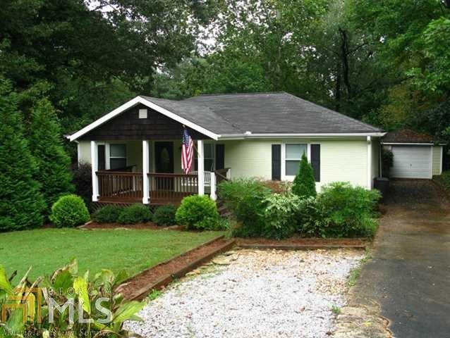 This meticulously maintained, 4-sided brick bungalow combines stunning curb appeal, an open and inviting floor plan and a host of intelligent upgrades to produce a fantastic living space you and your loved ones will adore. A 2007 top-to-bottom renovation with more than 25k of additional improvements, this 3 bed/2 bath home sits on one of the best streets in Midway Woods just minutes from Downtown Decatur. Stainless kitchen with gas range and granite counters, original hardwoods, two spacious decks, loads of energy improvements and a rare oversized garage or workshop.