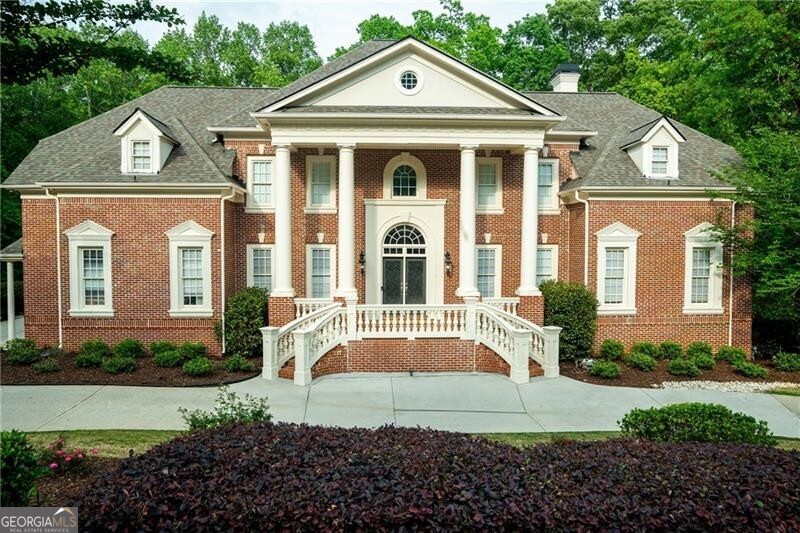 Experience unparalleled luxury and timeless elegance in this breathtaking Antebellum inspired, four-sides-brick estate, exquisitely situated under two miles from the heart of Downtown Alpharetta in the prestigious Harrington Falls community. Meticulously renovated, this stately residence welcomes you with a dramatic two-story Carrera marble foyer, an opulent space ideal for hosting grand gatherings. The entryway is flanked by an expansive formal dining room and a versatile flex space, perfect for an executive office, music room, or sophisticated sitting area. Beyond the arched entry, an abundance of natural light fills the open concept living area. The chef's kitchen is a culinary masterpiece, featuring dual islands, built-in commercial refrigerator and freezer, professional-grade range, ice maker, wine and beverage refrigerators - an entertainer's dream. Adjacent, the inviting two-story keeping room, centered around a cozy fireplace, seamlessly extends to a deck overlooking the sprawling, fenced-in backyard. A grand fireside great room, adorned with striking coffered ceilings flooded with light, offers an additional space for both intimate and large-scale entertaining. The main level also boasts a spacious ensuite guest bedroom large enough for a king-sized bed, a mudroom, laundry room, and perfectly situated powder room. Ascend to the upper level to discover a light-drenched, palatial primary suite complete with a private sitting area and an intimate fireplace- a true sanctuary. The spa-inspired ensuite offers a soaking tub bathed in natural light, a rejuvenating steam shower, and dual oversized walk-in closets. Three additional ensuite bedrooms, each generously proportioned, and a sunlit bonus room with a fireplace complete the upper level. The fully renovated terrace level offers extraordinary flexibility, featuring an expansive ensuite bedroom, a chic open concept living space, a stylish kitchenette, a dedicated office, an urban lounge area, and a versatile flex room ideal for a home gym or additional storage. Energy efficient newer systems further enhance this jewel: three HVACs, two tankless water heaters, and an architectural shingled roof. Additionally, new infiltrator lines installed for septic system and this house has been wired with CAT5 throughout! Nestled within the sought-after community of Harrington Falls, renowned for its stunning natural waterfall, this vibrant neighborhood offers an array of amenities: a clubhouse, resort-style pool, playground, pickleball and tennis courts, and a robust social calendar for both adults and children. Architecturally, this neighborhood has a variety of well-maintained custom homes, sidewalks on both sides of the road, extra wide roads, mailboxes at the curbs, and viewing ponds throughout the neighborhood. Residents enjoy an acclaimed summer swim team, ALTA tennis and pickleball leagues, and access to top-rated schools. Harrington Falls is a neighborhood where luxury meets community. Indulge in the perfect balance of serene privacy and unparalleled convenience, just moments from Downtown Alpharetta and Crabapple's charming shops and dining. Welcome Home to 350 Newcastle Drive.