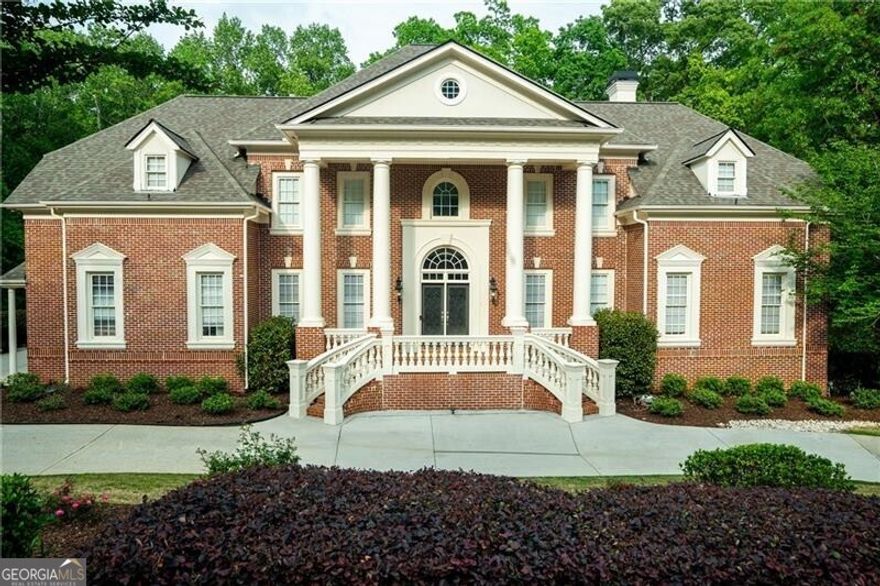 Experience unparalleled luxury and timeless elegance in this breathtaking Antebellum inspired, four-sides-brick estate, exquisitely situated under two miles from the heart of Downtown Alpharetta in the prestigious Harrington Falls community. Meticulously renovated, this stately residence welcomes you with a dramatic two-story Carrera marble foyer, an opulent space ideal for hosting grand gatherings. The entryway is flanked by an expansive formal dining room and a versatile flex space, perfect for an executive office, music room, or sophisticated sitting area. Beyond the arched entry, an abundance of natural light fills the open concept living area. The chef's kitchen is a culinary masterpiece, featuring dual islands, built-in commercial refrigerator and freezer, professional-grade range, ice maker, wine and beverage refrigerators - an entertainer's dream. Adjacent, the inviting two-story keeping room, centered around a cozy fireplace, seamlessly extends to a deck overlooking the sprawling, fenced-in backyard. A grand fireside great room, adorned with striking coffered ceilings flooded with light, offers an additional space for both intimate and large-scale entertaining. The main level also boasts a spacious ensuite guest bedroom large enough for a king-sized bed, a mudroom, laundry room, and perfectly situated powder room. Ascend to the upper level to discover a light-drenched, palatial primary suite complete with a private sitting area and an intimate fireplace- a true sanctuary. The spa-inspired ensuite offers a soaking tub bathed in natural light, a rejuvenating steam shower, and dual oversized walk-in closets. Three additional ensuite bedrooms, each generously proportioned, and a sunlit bonus room with a fireplace complete the upper level. The fully renovated terrace level offers extraordinary flexibility, featuring an expansive ensuite bedroom, a chic open concept living space, a stylish kitchenette, a dedicated office, an urban lounge area, and a versatile flex room ideal for a home gym or additional storage. Energy efficient newer systems further enhance this jewel: three HVACs, two tankless water heaters, and an architectural shingled roof. Additionally, new infiltrator lines installed for septic system and this house has been wired with CAT5 throughout! Nestled within the sought-after community of Harrington Falls, renowned for its stunning natural waterfall, this vibrant neighborhood offers an array of amenities: a clubhouse, resort-style pool, playground, pickleball and tennis courts, and a robust social calendar for both adults and children. Architecturally, this neighborhood has a variety of well-maintained custom homes, sidewalks on both sides of the road, extra wide roads, mailboxes at the curbs, and viewing ponds throughout the neighborhood. Residents enjoy an acclaimed summer swim team, ALTA tennis and pickleball leagues, and access to top-rated schools. Harrington Falls is a neighborhood where luxury meets community. Indulge in the perfect balance of serene privacy and unparalleled convenience, just moments from Downtown Alpharetta and Crabapple's charming shops and dining. Welcome Home to 350 Newcastle Drive.