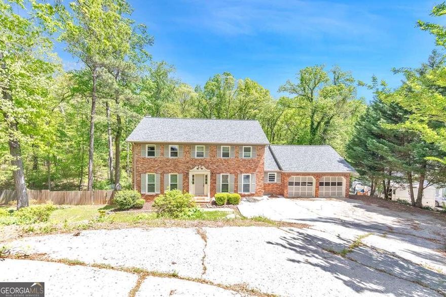 Welcome to this stunning 4-bedroom, 2.5-bathroom home located in the highly sought-after Walton High School district. As you enter, you're greeted by a grand foyer leading to a separate dining room and sitting room on either side. The sitting room flows seamlessly into the fireside family room, featuring built-in bookcases, bay windows, and a door opening to the expansive sunroom with vaulted ceilings. The kitchen boasts a breakfast bar, stone counters, updated appliances, and a charming breakfast room. A convenient laundry room and a half bathroom complete the main level. Upstairs, you'll find the luxurious primary bedroom suite with an ensuite bathroom featuring a sleek glass shower. Three additional bedrooms on the upper level share a full bathroom. The large unfinished basement provides ample storage space and has a door leading to the backyard. Outside, enjoy the large uncovered deck and a covered patio beneath it, overlooking the inviting in-ground saltwater pool. This home also features an attached 2-car garage. Located in a great East Cobb location, you'll have easy access to Downtown Roswell, the Chattahoochee River, plenty of shopping and dining options, and major roadways. Don't miss out on this incredible opportunity to live in this beautiful home!