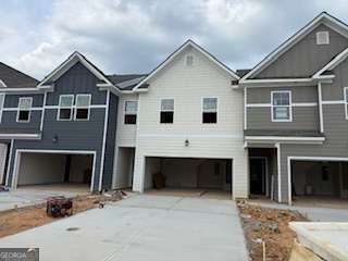 Modern Luxury Townhome in Rivershire Place. Nestled in the sought-after Villa Rica area, Rivershire Place offers a harmonious blend of modern living and convenience. This meticulously designed townhome features an open-concept layout, high ceilings, and a smart home technology package. Modern kitchen with stainless steel appliances, 42" Gray cabinets, tile backsplash, granite countertops, large island, and pantry. Oversized owners' suite with walk-in closet and spa-like ensuite bathroom with oversized shower. All rooms equipped with 2" faux wood blinds. Conveniently located just minutes from I-20 and Downtown Villa Rica, offering diverse dining options. A short drive to Sweetwater Creek and Arbor Place Mall adds to the appeal of this vibrant community. Please schedule an appointment to tour our decorated model homes. Interior photos are stock photos of the decorated model home with the same floor plan. Quik Move-in