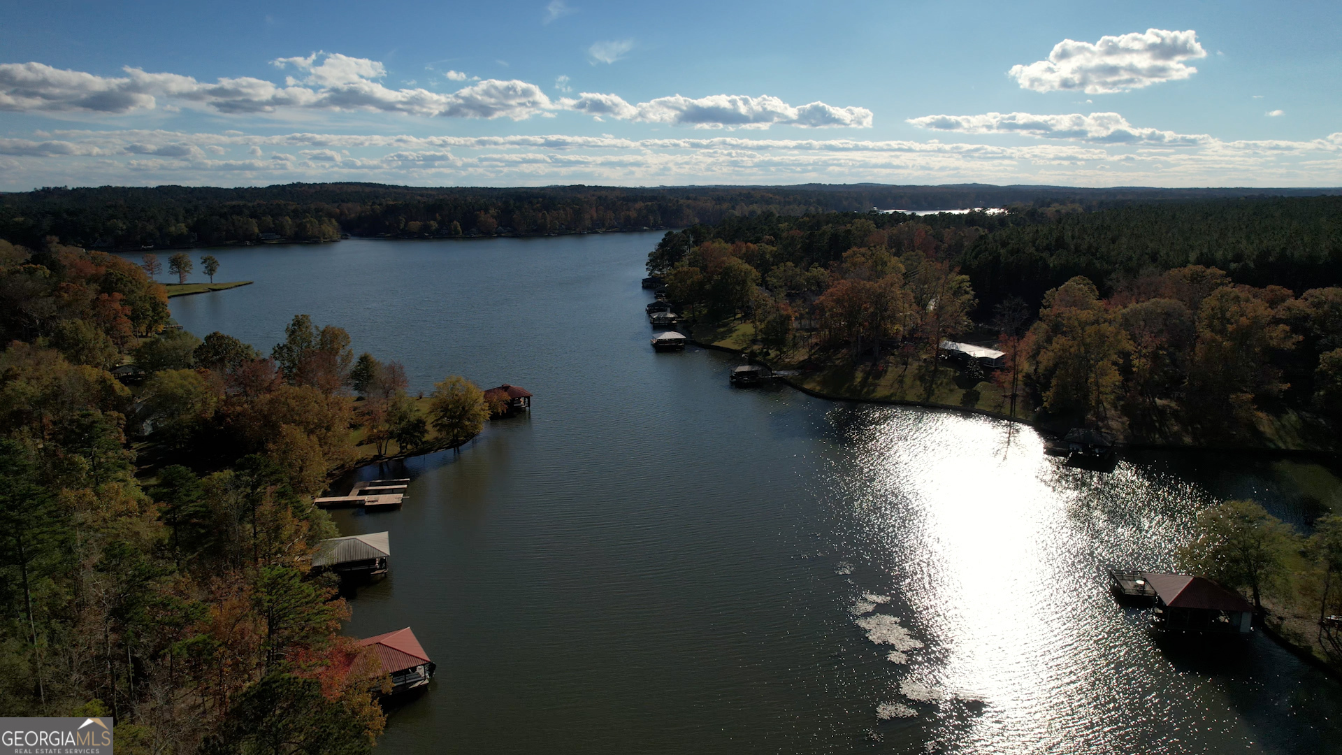 Serene Waterfront Lot in Oconee Springs - 1.06 Acres of Untapped Potential! Discover the perfect canvas for your dream home on this 1.06-acre waterfront lot nestled in the highly sought-after Oconee Springs community. Situated on the shimmering waters of Lake Sinclair, this pristine, unimproved parcel offers endless possibilities to create your ideal lakeside retreat. With over an acre of lush, wooded terrain and direct access to the lake, you'll enjoy unparalleled privacy, water views, and the gentle sounds of nature. Whether you envision a custom-built home or a relaxing outdoor oasis, this property provides the perfect backdrop to bring your vision to life. Located in a peaceful setting, the lot offers a sense of seclusion while being just minutes from local recreational activities. Enjoy boating, fishing, and lake living at its finest, all within the embrace of Oconee Springs' tranquil setting. Don't miss your chance to own a slice of waterfront paradise-this is more than just a lot; it's the foundation of your future haven! Contact us today to explore the possibilities.