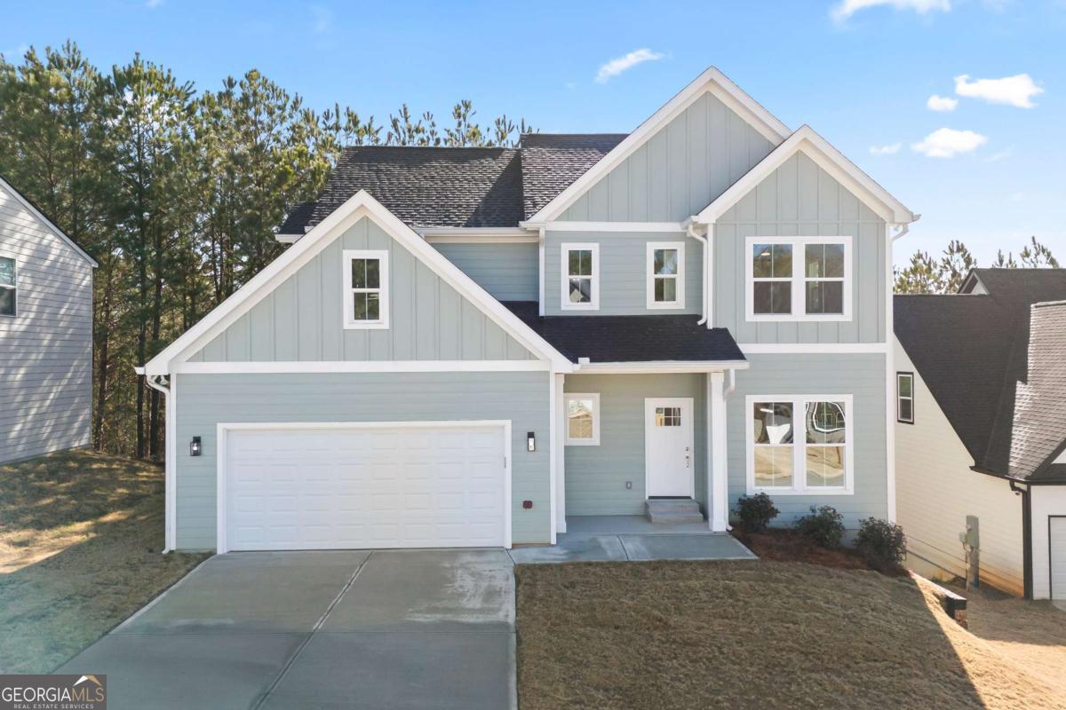 Welcome to this stunning NEW CONTRUCTION 3-bedroom, 2.5 bath home, thoughtfully designed for both style and functionality. Experience true hardwood floors flowing throughout the home, complemented by stylish tile in the bathrooms and laundry room. The main floor greets you with a welcoming foyer, leading to a separate dining room and a beautifully appointed kitchen featuring ample white cabinetry, a large solid surface island, and countertops. The kitchen seamlessly flows into the living room, creating the perfect space for entertaining. An additional main-floor flex space offers endless possibilities - it can serve as extra storage, a mudroom, or a cozy office. The garage has been upgraded with an epoxy-coated floor for added durability and style. Abundant windows throughout the home allow natural light to pour in, creating a bright and airy atmosphere. Upstairs, you'll find three generously sized bedrooms, including a luxurious primary suite with a spacious en-suite bathroom featuring a double vanity, tile floors, a separate tub and shower, and a large walk-in closet. The two additional bedrooms each include walk-in closets and share a charming Jack-and-Jill bathroom, accessible through stylish sliding barn doors. This bathroom is complete with a double vanity, tile floors, and a tub/shower combo. A conveniently located, well-sized laundry room with tile flooring completes the upper level. For even more potential, this home sits on an unfinished basement, ready for your personal design touches. Don't miss the opportunity to make this exceptional home yours! Priced below appraised value and is available now!