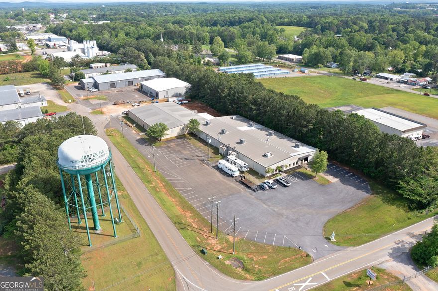 Investor's Dream - Perfect 1031 Exchange Opportunity with Upside Potential  Three Industrial M1-Zoned Buildings | Jasper, GA    Seize this rare opportunity to acquire a portfolio of three industrial M1-zoned buildings in the growing market of Jasper, Georgia. Ideal for a 1031 exchange, owner-user, or value-add investor, this offering combines immediate income with long-term potential. With limited industrial space available in the region, this is a high-demand asset class with strong fundamentals.    Property Highlights:    93 Pioneer Industrial Blvd - Vacant and Available for Lease or Occupancy  This building is actively being marketed for lease at market rates. Ideal for an owner-user or investor looking to add value through leasing.    Note: If this building is leased prior to a binding contract, the sale price may be adjusted to reflect the added income.    120 Don Westbrook Ave - Fully Leased at $12/SF NNN  Generates $144,000 in annual net income. Current lease provides stable cash flow. Buyer has option to terminate lease, offering flexibility for occupancy or repositioning.    161 Don Westbrook Ave - Leased at $8.87/SF NNN, Netting $204,000 Annually  Strong in-place tenant provides consistent returns. Tenant has until the end of July to exercise a 3-year renewal option. If the option is not exercised, the building will become available for occupancy on November 1, presenting a potential owner-user or re-tenanting opportunity.    Total Income: $348,000 Annually (NNN)  Each building provides flexibility for leasing, repositioning, or end-user occupancy. Industrial space in North Georgia remains in short supply, making this portfolio an attractive investment with built-in upside and income stability.