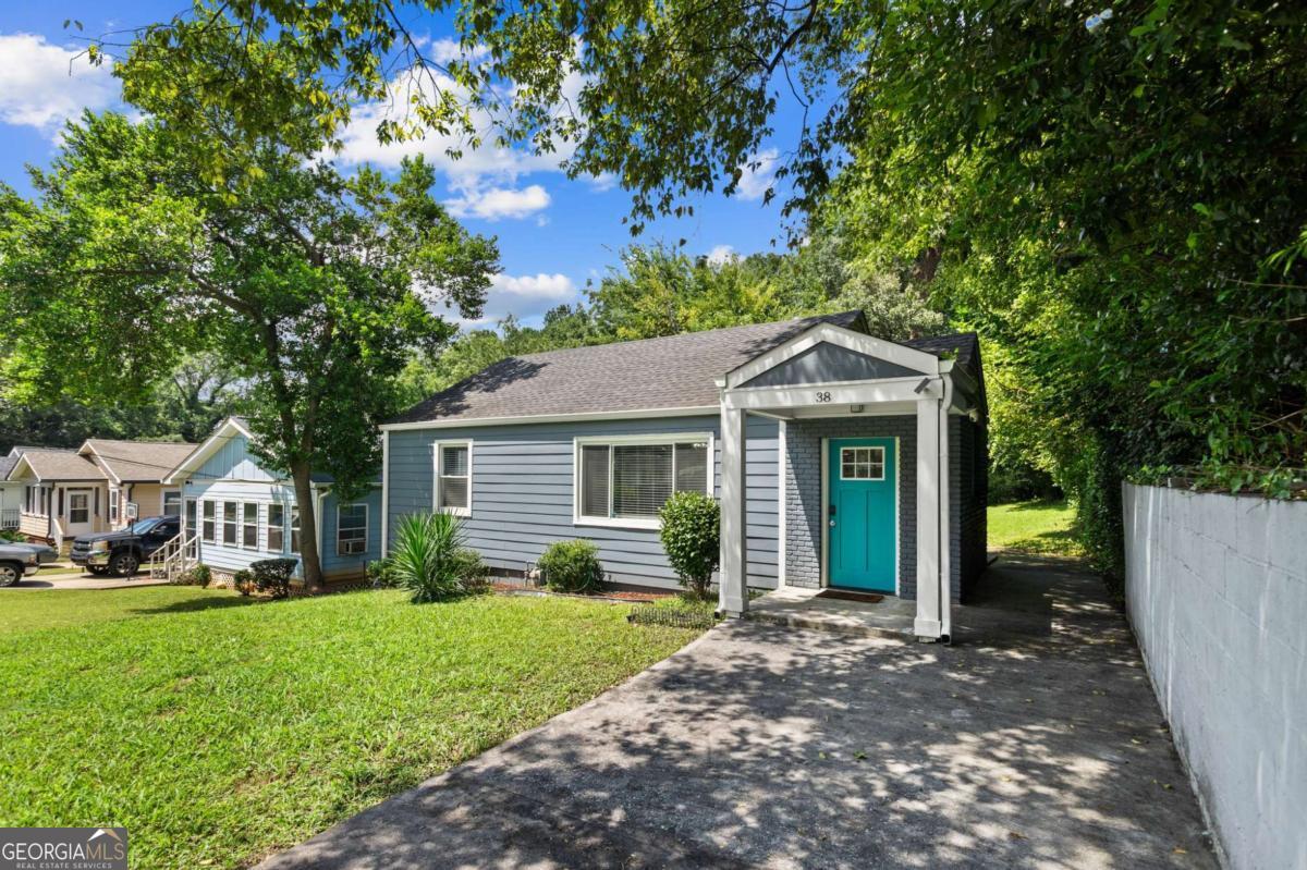 Discover the perfect blend of historic charm and modern convenience at 38 Adair Avenue SE, nestled in the welcoming Lakewood Heights neighborhood. This beautifully refreshed 3-bedroom, 2-bathroom home offers 1,294 sq ft of light-filled, thoughtfully updated living space. Step inside to find refinished hardwood floors and fresh, neutral paint throughout, showcasing an inviting, open ambiance. Updated stainless steel Samsung appliances-including a Wi-Fi-enabled convection range-bring both flair and function to the kitchen. Controlled via smart home devices, modern fixtures keep every corner of the house sleek and connected. The oversized Owner's Suite offers serene private access to the back patio and a spacious walk-in closet-a calm retreat that balances both comfort and style. Outside, entertain with ease on the side concrete patio, or enjoy peaceful moments in the generous front and backyard, perfect for morning coffee or weekend gatherings. Recent upgrades, including a new hot water heater with expansion tank, enhanced landscaping, new gutters, exhaust vents, and added security features, ensure move-in readiness and energy-efficient living. The home's location is more than convenient, it's central. Just minutes away from Hartsfield-Jackson Atlanta International Airport, Browns Mill Park & Golf Course, Carver Family YMCA, South Bend Park and nearby transit such as Lakewood-Ft. McPherson MARTA Station. Don't just picture life here-experience it. Whether it's morning coffee on the patio, evenings in your oversized Owner's Suite, or weekends exploring Atlanta's best, 38 Adair Avenue SE offers the perfect mix of charm, comfort, and convenience. Opportunities like this don't last long-schedule your showing today and make this Lakewood Heights gem yours.