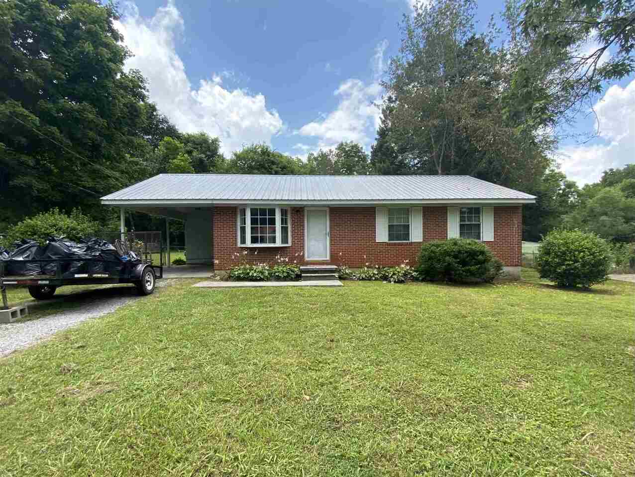 Looking for a one level home? Take a look at this nice 3 bedroom, 1 bath home in convenient location. Good living room space with kitchen / dining combo. Hardwood floors throughout. Exterior is all brick for easy maintenance. Metal roof. Big level fenced back yard is perfect for pets or children. This one is priced to sell so call today!