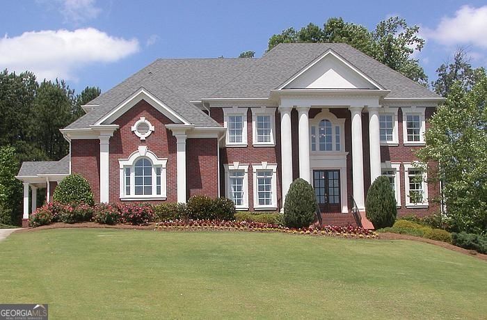 Wonderful four sides brick estate home on almost one acre lot in prestigious Sugarloaf Country Club, a guard gated community. Inviting open floor plan. Gourmet kitchen with creamy white cabinets and granite. Great room with coffered ceiling and fireplace flows to sunroom making for a delightfully open floor plan. All main floor areas freshly painted in modern color palette! Luxurious master suite upstairs with fireplace. Large secondary bedrooms with ensuite bathrooms and walk-in closets. Awesome terrace with gleaming hardwoods, entertaining bar with brick wall, billiards rm, media room, full bedroom/bathroom, bonus room and more. Fabulous, lush, large backyard. House has been freshly painted. $6000 for 24+ month lease. $6500 for shorter lease.