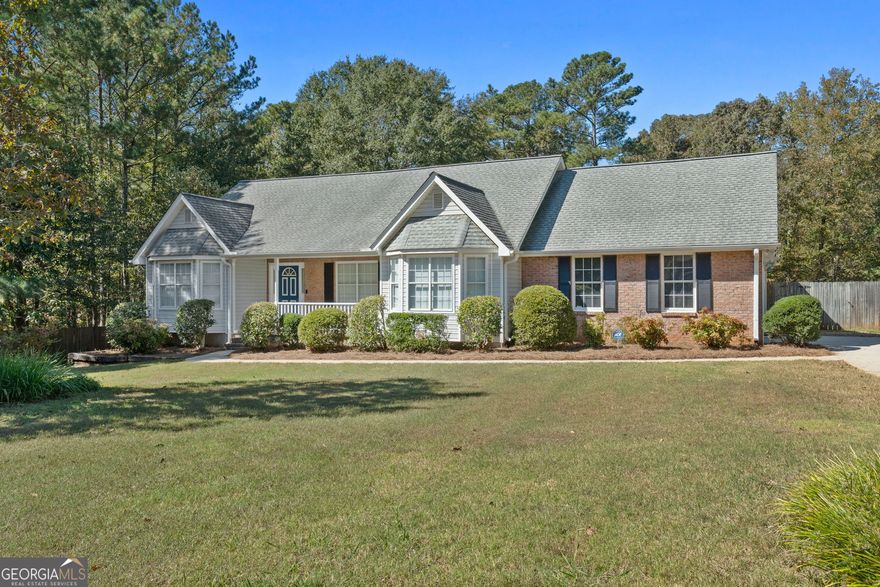 Don't miss this opportunity to purchase a value-packed property at a very attractive price point in McDonough! This brick-front ranch is situated on an approximately 3.11 acre cul-de-sac double lot in the quaint Orleans Place neighborhood. Inside you'll find a split-bedroom plan with 3 bedrooms and 2 bathrooms. Foyer entry with hardwood floor. Formal dining room with tray ceiling. Don't ever use a dining room? It would make an awesome den, office or playroom! Living room includes a vaulted ceiling and gas starter fireplace, and overlooks rear deck. Kitchen with tile backsplash, wall-to-wall cabinetry, gas range and stainless steel dishwasher. Bay window breakfast area. Large laundry room with pantry for kitchen essentials. Primary bedroom with tray ceiling, walk-in closet and its own private door to the rear deck. Primary bathroom with double sink vanity, soaking tub and separate shower. Newer HVAC and water heater. Outside you'll find a well-manicured yard dappled with apple and pear fruit trees. Gated access to backyard. Need a place to park the RV or boat? You'll love the approximately 24x50 RV shed with 14-foot sides! It even has existing conduit in place for electrical service. If you need a workshop or just extra storage space, the +/- 28x20 outbuilding is a perfect spot! This property has been well cared for and it shows. And it's close to everything! Easy access to Highway 20/81 and I-75. Just a stone's throw to shopping and dining at the South Point retail development, Lowe's, Walmart and BJ's wholesale club.