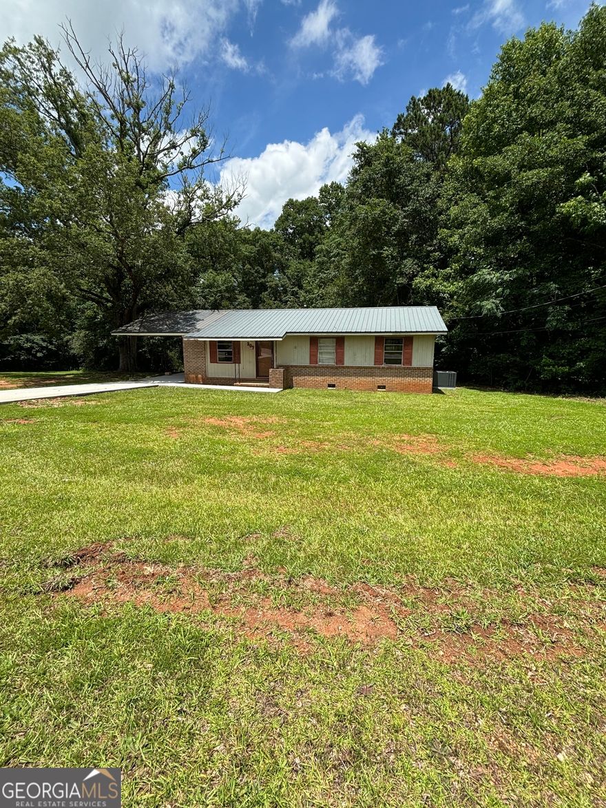 1 acre corner Lot! 4 sided brick, convenient 75 S/N access! this house has been given a brand new driveway and a large brand new AC UNIT. it is a fixer upper and is sold as is.