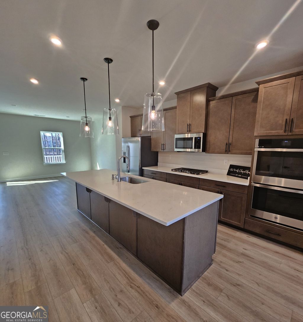 Photo of 852 Woods Chapel Rd, Sugar Hill, GA 30518 (MLS # 10681406)