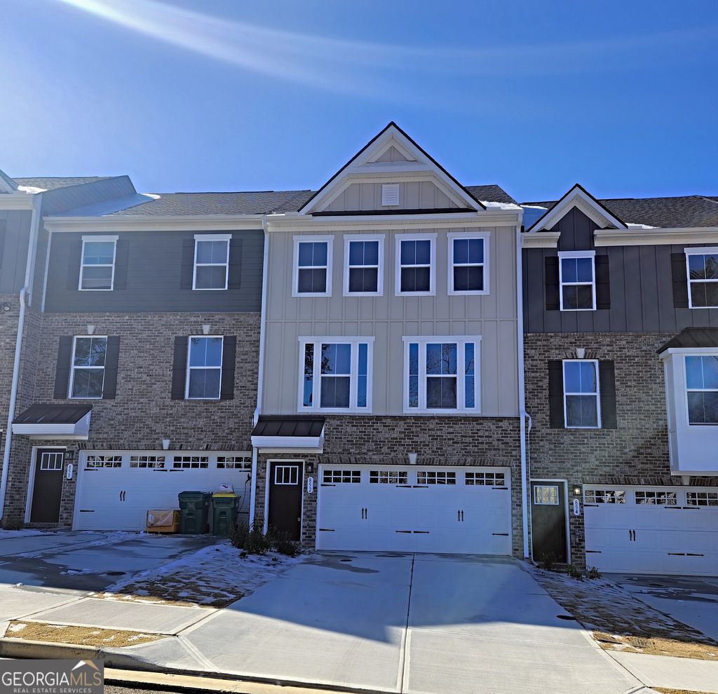 Photo of 852 Woods Chapel Rd, Sugar Hill, GA 30518 (MLS # 10681406)