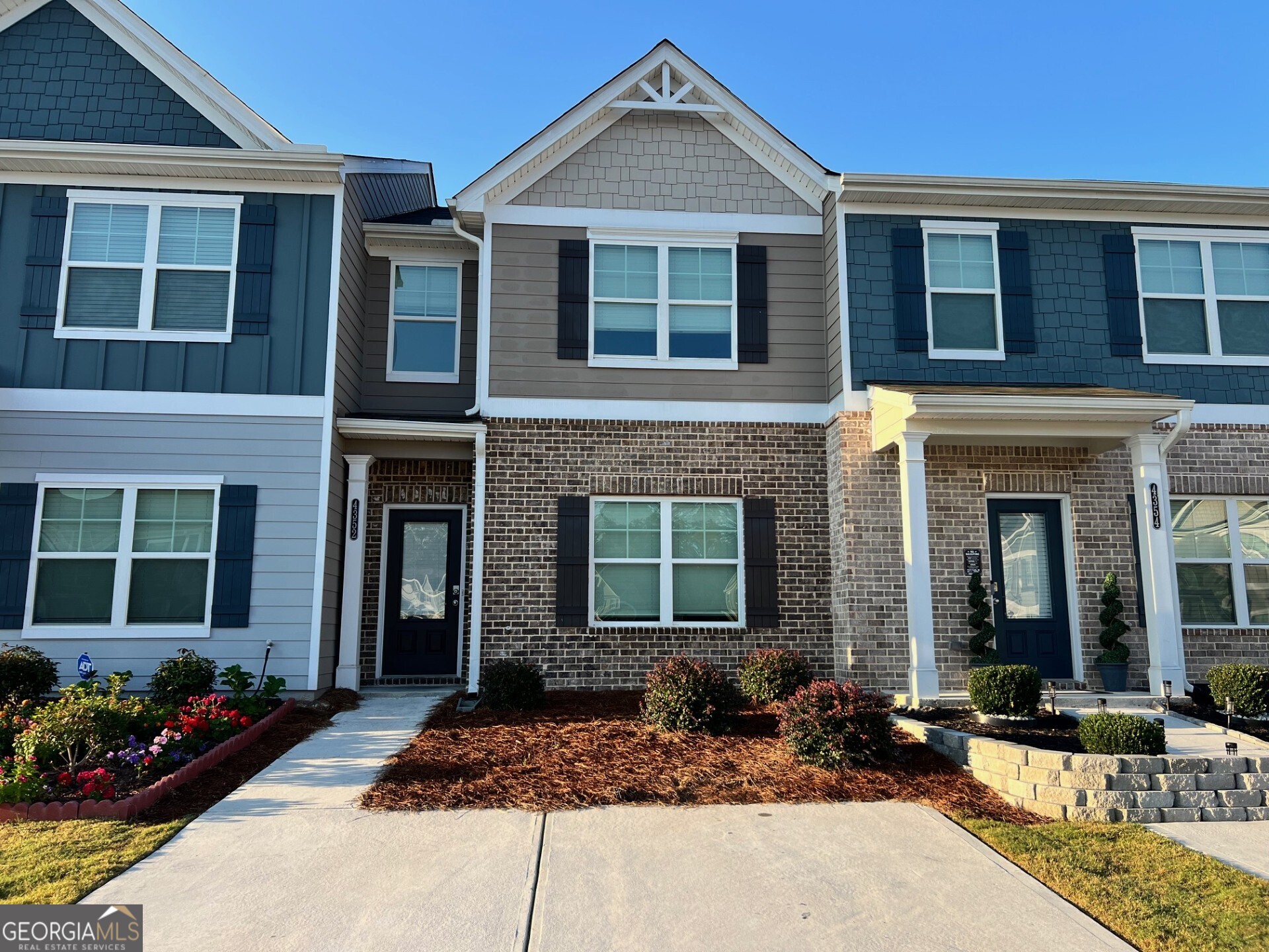 Welcome to your perfect autumn retreat! This beautifully maintained modern townhome offers the ideal blend of style, comfort, and functionality-just in time to nestle in before the holidays. Step inside and you are greeted by a versatile flex room-the perfect space to customize as a home office, playroom, dining room, or creative retreat. The open and airy floorplan flows into a chef's kitchen with granite countertops, sleek gray cabinetry, and a spacious island with undermount sink-ideal for cooking and entertaining. Unwind in the family room with a cozy fireplace, creating the perfect setting for fall evenings. Upstairs, the owner's suite impresses with its size and privacy, complete with a spa-inspired bath featuring dual vanities with granite counters and a large walk-in shower. Two additional bedrooms and a hall bath with granite countertops provide plenty of space for family or guests. Enjoy your private backyard for crisp fall mornings and year-round relaxation. With its unbeatable location and thoughtful design, this home is ready for you to create lasting memories. Do not miss your chance to move in before the holidays-this is the home sweet home you have been waiting for!