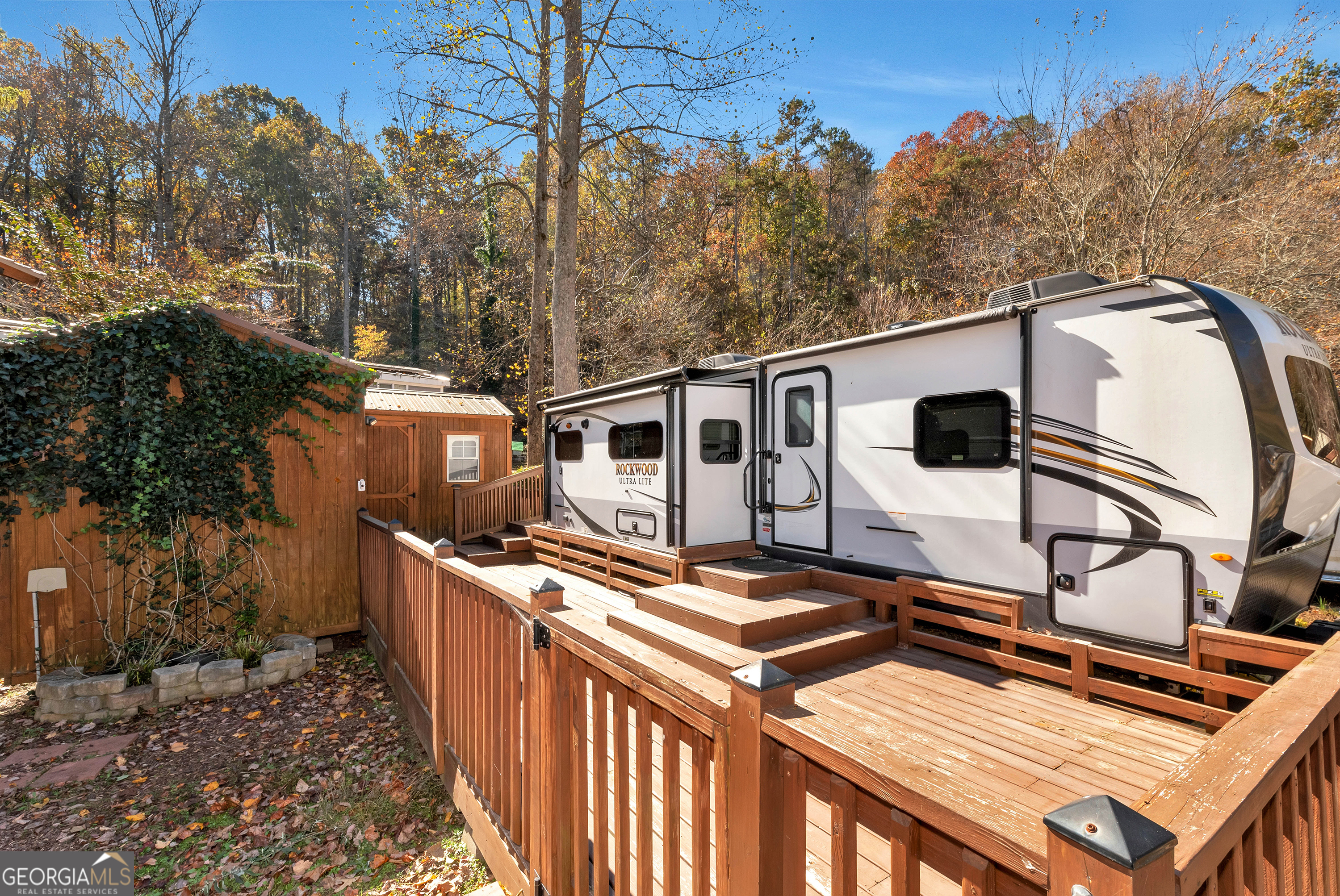 LIKE NEW 2019 Rockwood Ultra Lite Camper with 2 bedrooms and 1.5 baths. One bedroom with queen bed + bunk area & 1/2 bath makes a great space for the overnight guest. Plenty of room for comfort! Just a short walk to the Chattahoochee River - perfect for fishing, kayaking, or relaxing. Other features include a large decking, two large outdoor buildings, and plenty of room for parking. Easy to maneuver camper in and out!