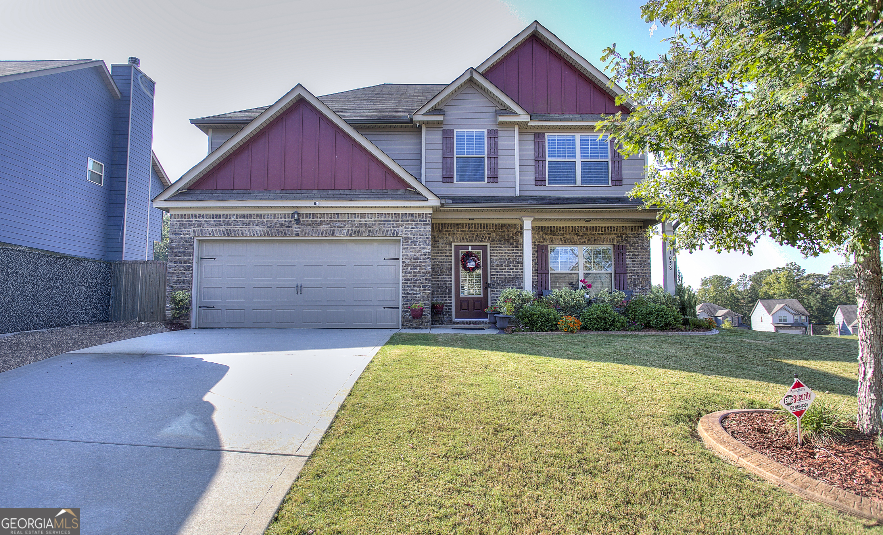 This home qualifies for USDA 100% financing & $5000 Grant from Chase Bank. Veterans qualify for $7000 Grant from Chase Bank. Seller will provide buyer with a 1-year home warranty and will provide $5000 toward buyers closing cost, She Shed in back yard will remain with the home. Grove Village is a charming Gated community in rural Locust Grove. This craftsman-inspired home, situated on a corner lot, offers an abundance of space and comfort. It features 5 spacious bedrooms and 3 full baths. The open family room has a brick hearth, wood-burning fireplace, and opens to the chef-style kitchen, granite countertops, stainless steel appliances, 42- inch cabinets, and backsplash, also a breakfast area and formal dining area or maybe make it a sitting room. This area is great for entertaining and creating lasting memories. A guest bedroom on the main level plus a full bath with linen closet. Upstairs you will be amazed at the massive owner's suite with a sitting area, vaulted ceiling, that is the perfect retreat after a long day, you can relax and enjoy the garden tub w/tile surround, separate glass door shower, double vanity, and huge walk-in closet. All the secondary bedrooms are very spacious with walk-in closets. The upstairs bathroom has linen closets as an added touch. The laundry room has shelving and is great for storage. Enjoy the extended patio and backyard area as it s leveled and sodded, great for outdoor fun and relaxation. This house has landscape lighting on the house that automatically comes on at dusk and off at daylight. The amenities offered within the gated community are a soccer field, playground, and fenced basketball area. Minutes to shopping at Tanger Outlets, I-75, and schools. This home qualifies for USDA 100% financing & $5000 Grant from Chase Bank. The seller will provide the buyer with a 1-year home warranty and will pay a portion of the buyers closing costs.