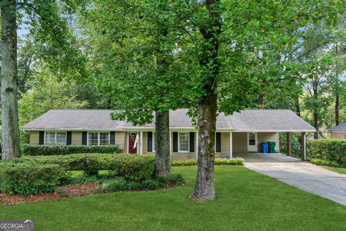 Step inside this renovated 3 Bedroom / 2 Bath Ranch and discover a thoughtfully redesigned floor plan that blends style, function, and comfort. The heart of this home is a modern, open layout! The Living Room/Family Room is spacious and bright, plus a Dining Area that's open and inviting for everyday living and entertaining. Updated with new flooring throughout, neutral paint colors, recessed lighting and a white-washed brick fireplace topped with a sleek wood mantel to create a warm welcoming living space. The kitchen features SS appliances, modern sink with disposal, solid surface countertops, under cabinet lighting, pantry, and a convenient butcher block counter for prepping your culinary masterpieces! The refrigerator remains with the home, as well as the newly installed vent hood (with built-in speaker!) over the range. There is a fun, pop of personality with the contrasting blue lower cabinets over traditional white cabinets. The bright breakfast nook is perfect for your morning coffee or casual dinners. A large Laundry Closet with extra storage rounds out this amazing kitchen! Venture outside through the back deck door that opens to a NEW large composite deck big enough for al fresco dining, grilling, and room to relax on those lounge chairs you've always wanted! This inviting backyard retreat comes complete with a firepit! In classic ranch style, the bedrooms are down the wide hallway with a separate guest bath. The primary suite features an ensuite bath with a large shower! And there's a fantastic basement with a craft room, workshop, a fully finished Movie Room/Man Cave/Play Room. There is also a huge storage room with built-in shelves for all your decorations and special treasures. In addition to the deck, other further major updates include a new AC (2024), gutter guards, and more! All the heavy lifting has been done - this beauty is ready for you! Don't miss the opportunity to make this home your own!