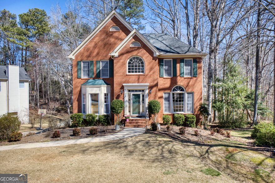 MOTIVATED SELLER!!! Welcome Home to the Highly Desirable Grace Lake Community in Douglas County!  This stunning 4-bedroom, 2.5-bath home boasts a charming brick-front exterior. The 4th bedroom is a bonus room that can also be used as a theater room. Step inside to find an oversized family room featuring gleaming hardwood floors, a cozy fireplace perfect for chilly Georgia nights, and abundant natural light. Around the corner, the modern updated kitchen awaits, complete with a spacious dining room that comfortably seats 12+ guests, as well as a separate eat-in kitchen for more casual meals. Upstairs, the spacious master suite is filled with natural light and features an ensuite bathroom. For added convenience, the laundry area is also on the upper level. The basement offers even more space, including a large workshop. Located just steps from the community recreation area, this home is nestled in a quiet, family-friendly neighborhood with easy access to schools, parks, and shopping. Plus, you're only 30-45 minutes from Downtown Atlanta, Mercedes-Benz Stadium, The Battery, and Hartsfield-Jackson Airport! This is a must-see home, and the sellers are highly motivated-don't miss out on this fantastic opportunity!
