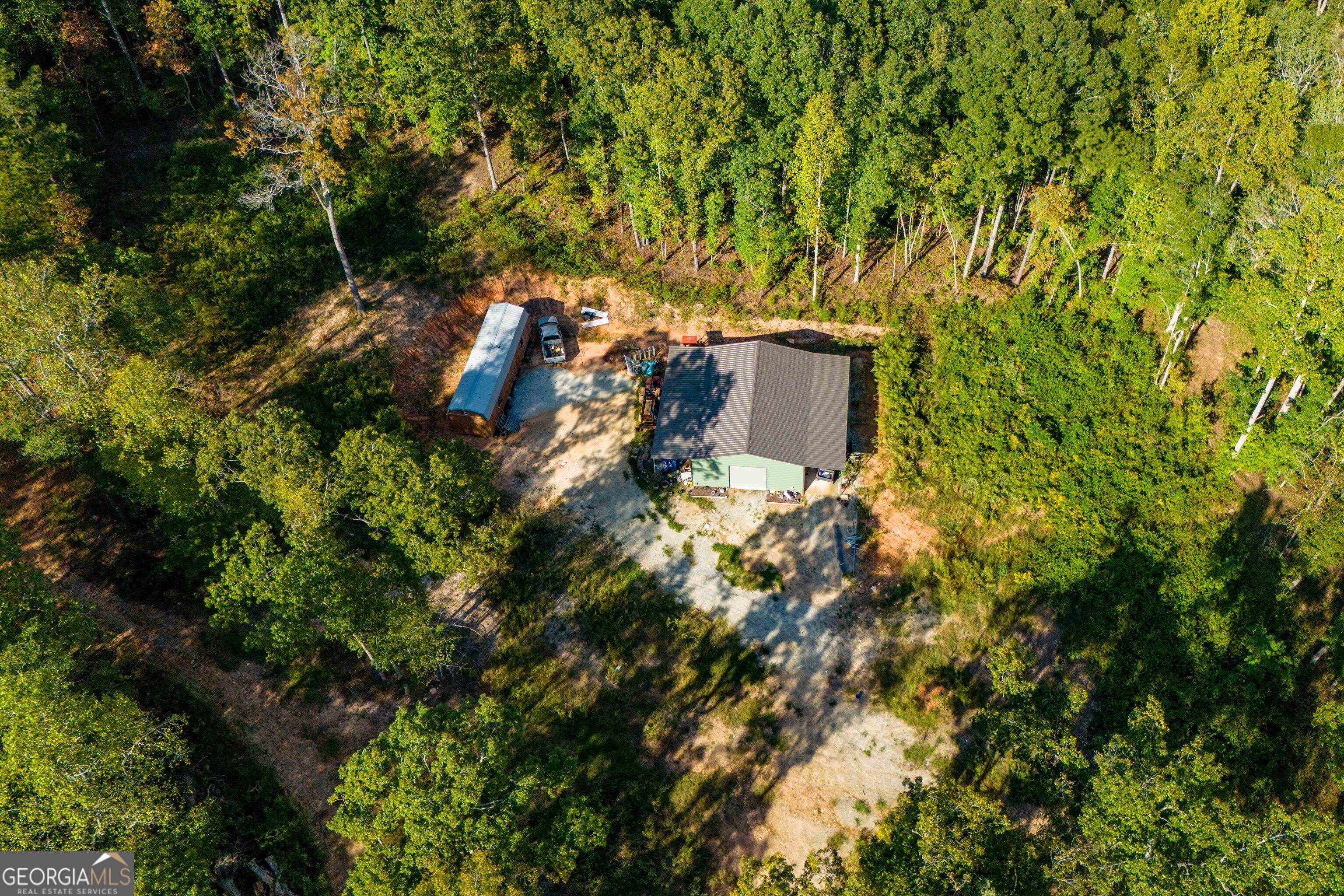 Three tracts of beautiful wooded property with a total of 40.81 acres. One deer plot, 2 creeks (the larger creek feeds into Lake Seaton), a 30 X 40 barn with concrete floor, 2 storage sheds, a garden area, several areas cleared for building, a large rock fire pit near the small creek. Lot of natural ferns around the creeks. The back tract is natural and untouched. Currently zoned agricultural and in a land covenant for property tax break. Perc test has been completed on the 2 front tracts. Easement access to all 3 tracts.