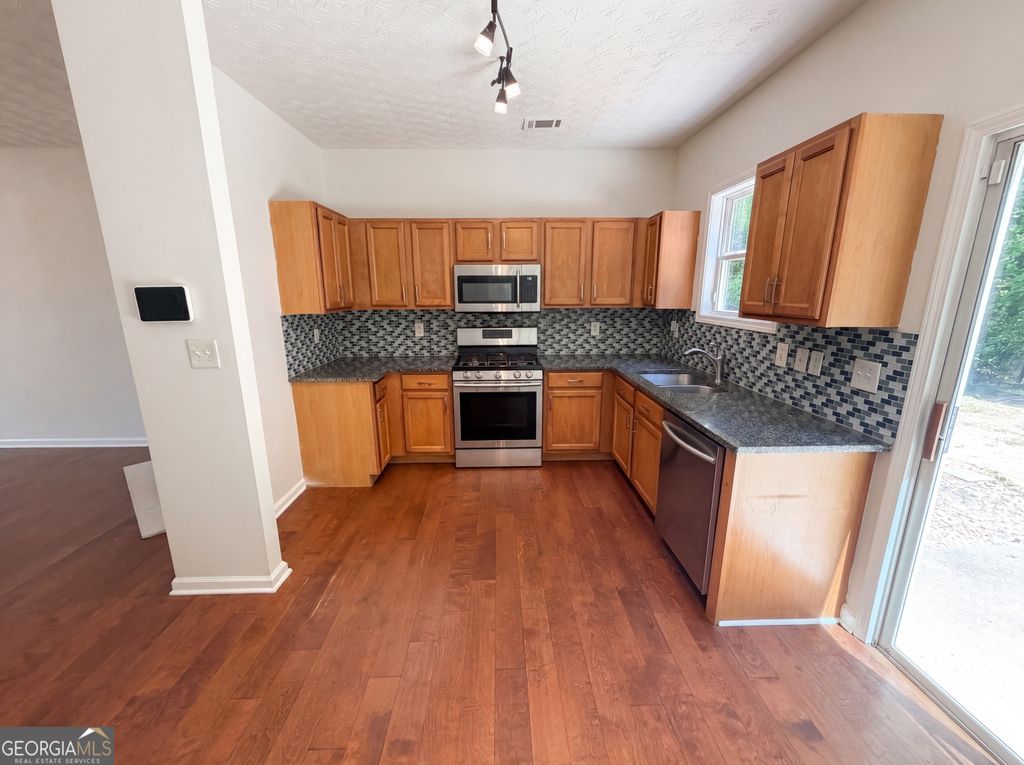 Photo of 603 Marsh Lake Road, Lawrenceville, GA 30045 (MLS # 10761516)