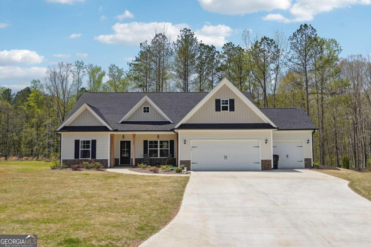 Welcome to this charming ranch-style home nestled in a quiet cul-de-sac lot! Featuring a timeless combination of vinyl siding and stackstone base, this home boasts elegant columns outside and a three-car front entry garage for added convenience. Step inside to discover a spacious office to the left, with a double door entry for privacy, and a beautifully appointed dining room to the right! Just ahead, youCOll find a cozy den with durable hard flooring, perfect for both comfort and relaxation. Gather around the gas fireplace in the living area, or enjoy cooking a meal together in the upgraded kitchen accented by granite countertops and stainless appliances, an electric cooktop and a deep farm sink! Enjoy the convenience of a separate laundry room and mudroom, along with a three-car garage providing ample storage space. Retreat to the master bedroom complete with a huge walk-in closet and a master bath featuring a garden tub, double sink vanity, and an exit to the backyard. This home offers better-than-new construction quality, with thoughtful touches like a pantry with a sliding barn door, an eat-in area, and a pulldown attic for additional storage. Two secondary bedrooms and a full bath provide comfortable accommodations for family and guests. Don't miss the opportunity to make this meticulously maintained, better-than-new, ranch-style home yours!