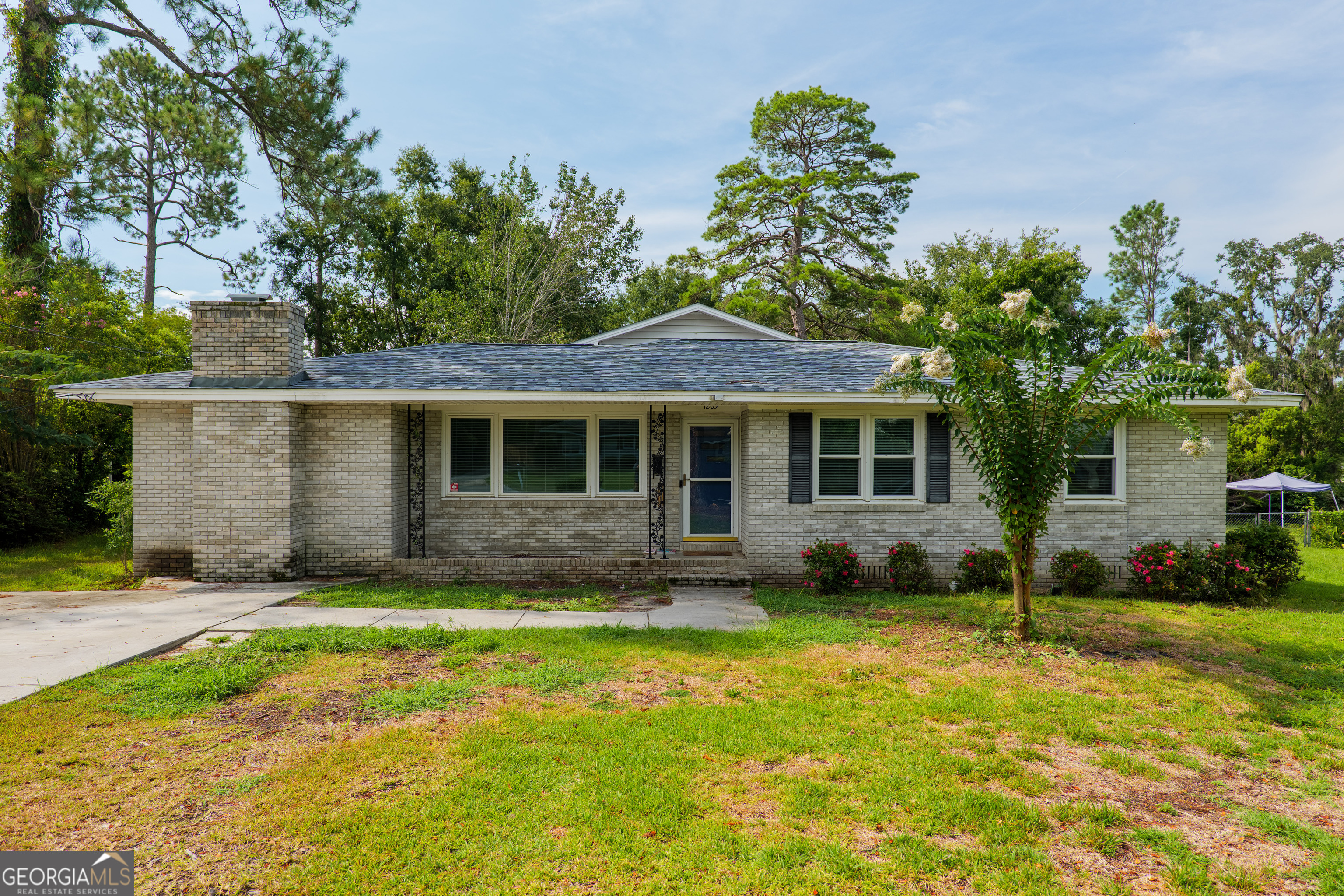 Welcome to this truly unique 5-bedroom, 3.5-bathroom home offering 2,616 sq ft of beautifully updated living space with a new roof (2024) in the heart of Valdosta, Georgia. Thoughtfully remodeled, this property blends charm and functionality with a rare 1.5-story layout, creating a natural split-floorplan feel-perfect for multi-generational living, a growing family, or added privacy. Inside, you'll find five spacious bedrooms and three and a half modernized bathrooms. The inviting great room with hardwood floors flows seamlessly into a cozy family room, while the eat-in kitchen features a breakfast bar and connects to a formal dining room-ideal for everyday living and entertaining. Large rooms and abundant storage add to the home's practicality. Step outside to a private backyard with mature landscaping, two storage buildings, and a 14x14 covered storage area-perfect for relaxing or weekend projects. This one-of-a-kind property is ideally located near VSU, SGMC, grocery stores, parks, walking tracks, shopping, and dining, offering unmatched convenience and lifestyle. If you're seeking space, style, and a central location-this Valdosta gem is a must-see!
